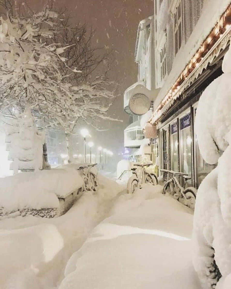 A Snow Covered Street With A Bike Parked In It
