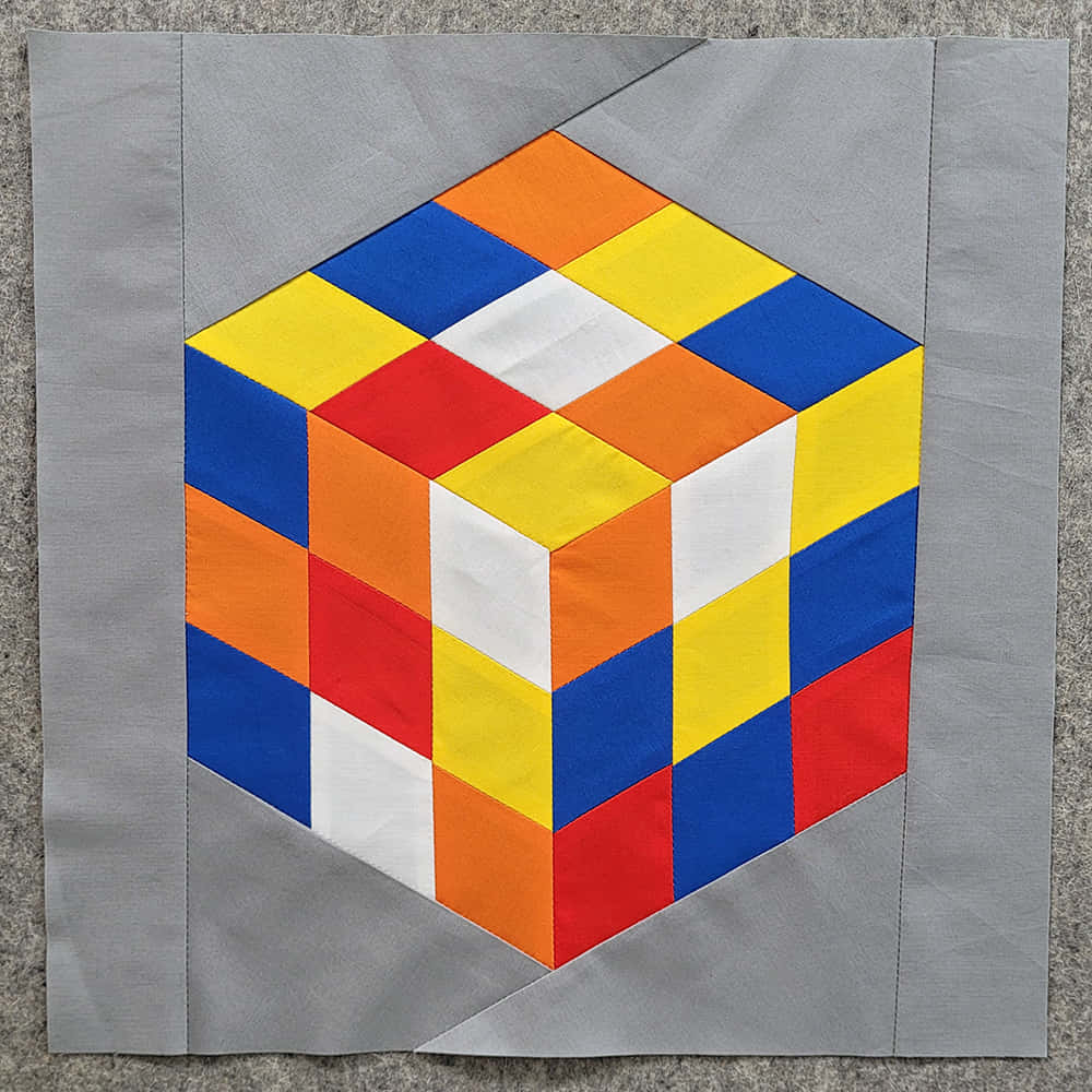 A Quilt Block With A Colorful Design