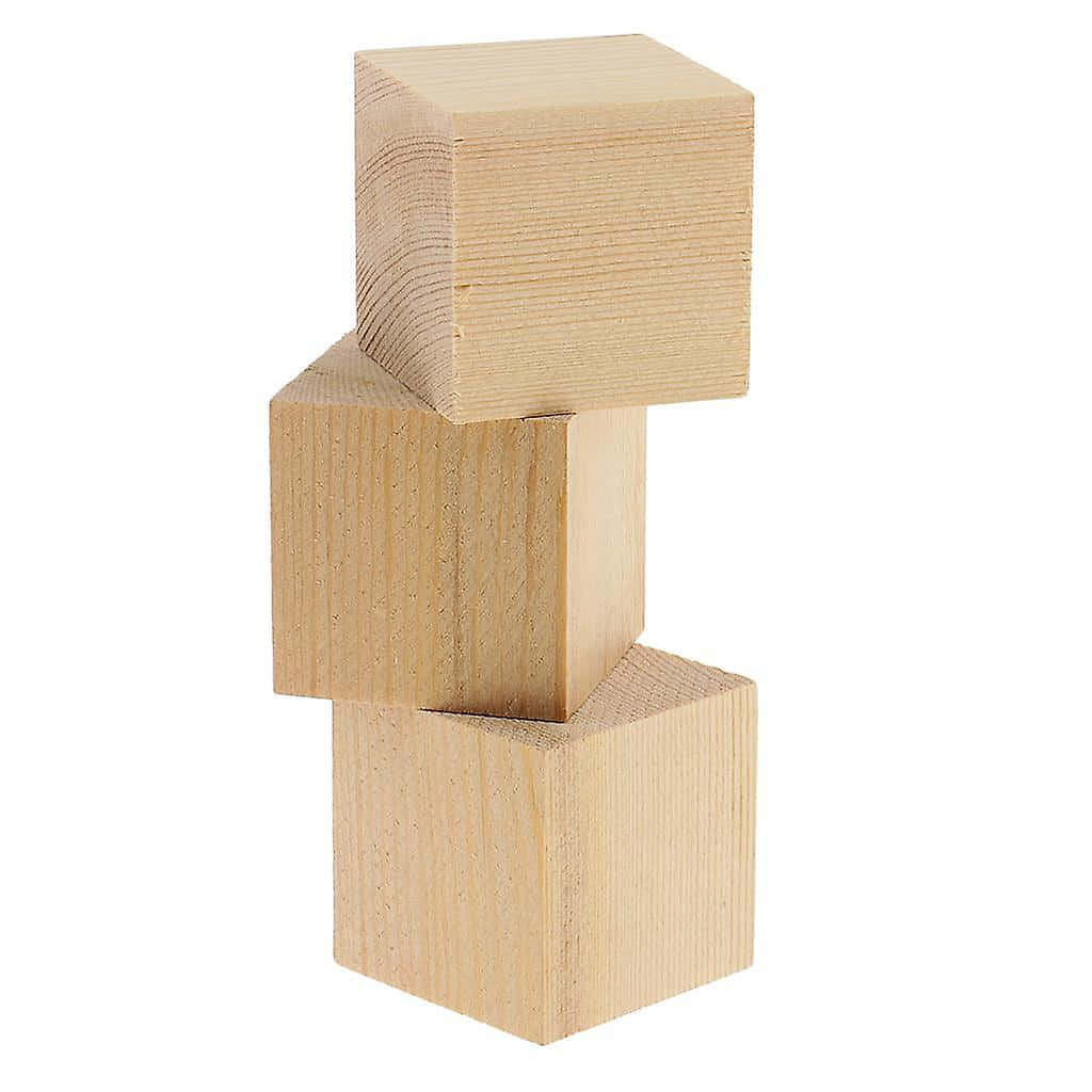 Three Wooden Blocks Stacked On Top Of Each Other
