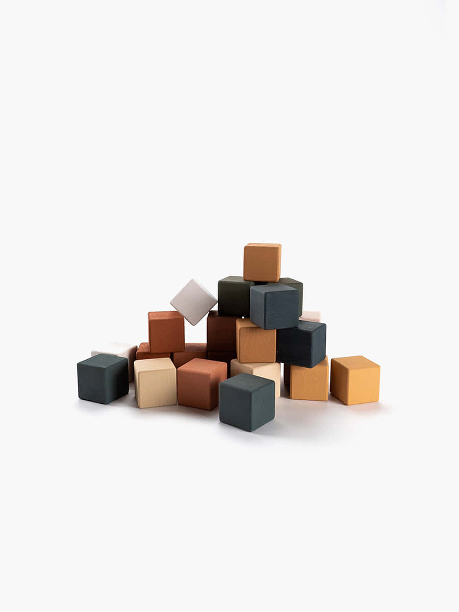 A Pile Of Wooden Blocks On A White Surface