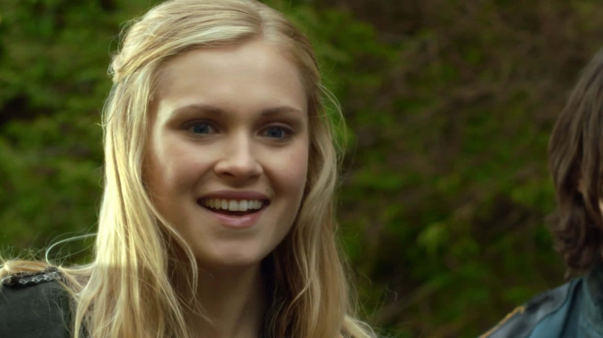 Blonde Actress Smiling Outdoors Wallpaper
