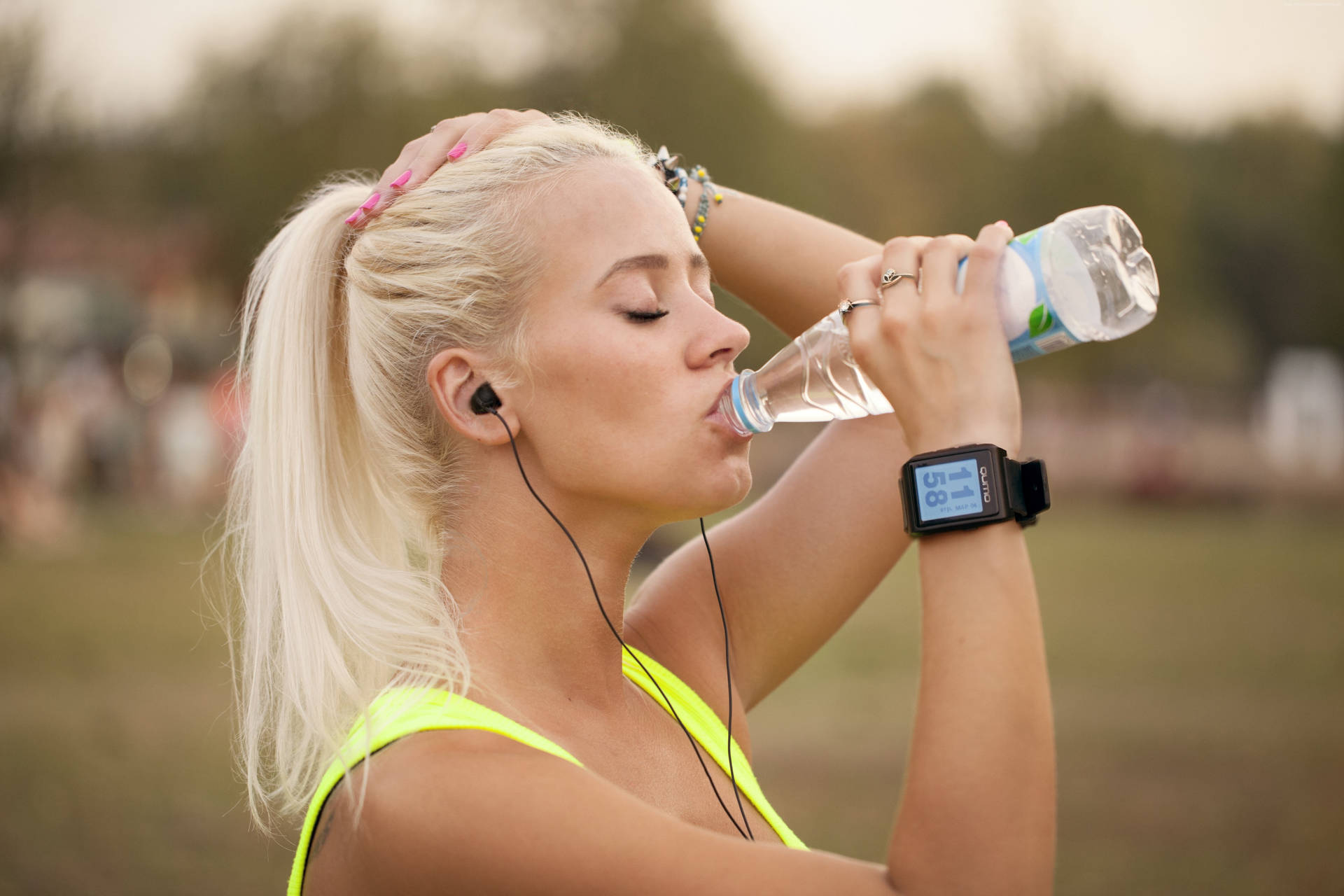 Blonde Woman Drinking Water From Bottle Wallpaper