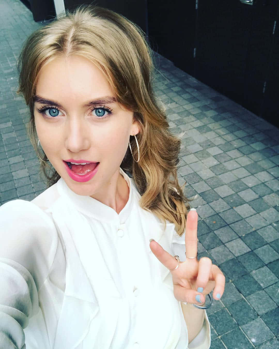 Blonde Woman Peace Sign Selfie Wallpaper