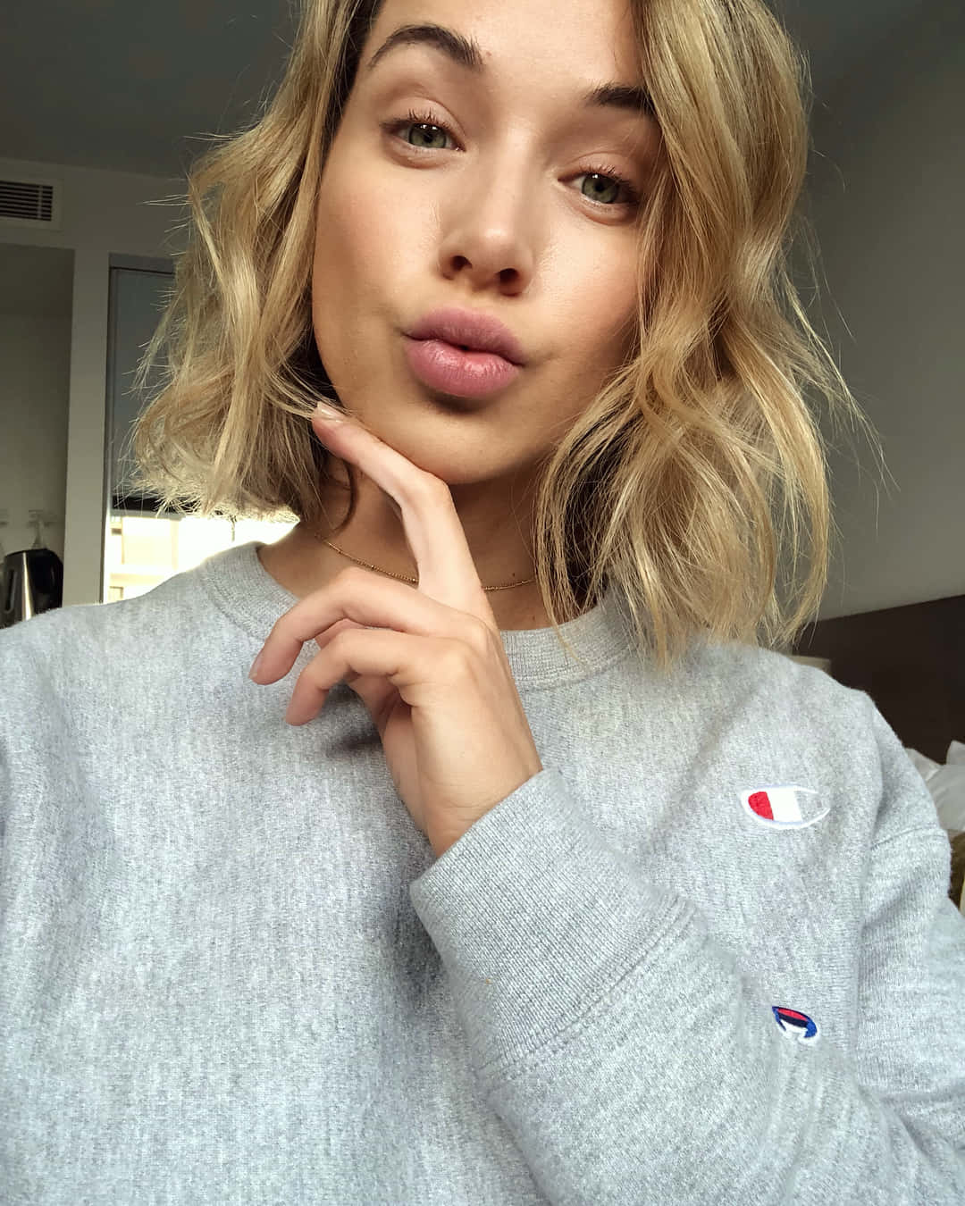 Blonde Woman Puckered Lips Grey Sweater Wallpaper