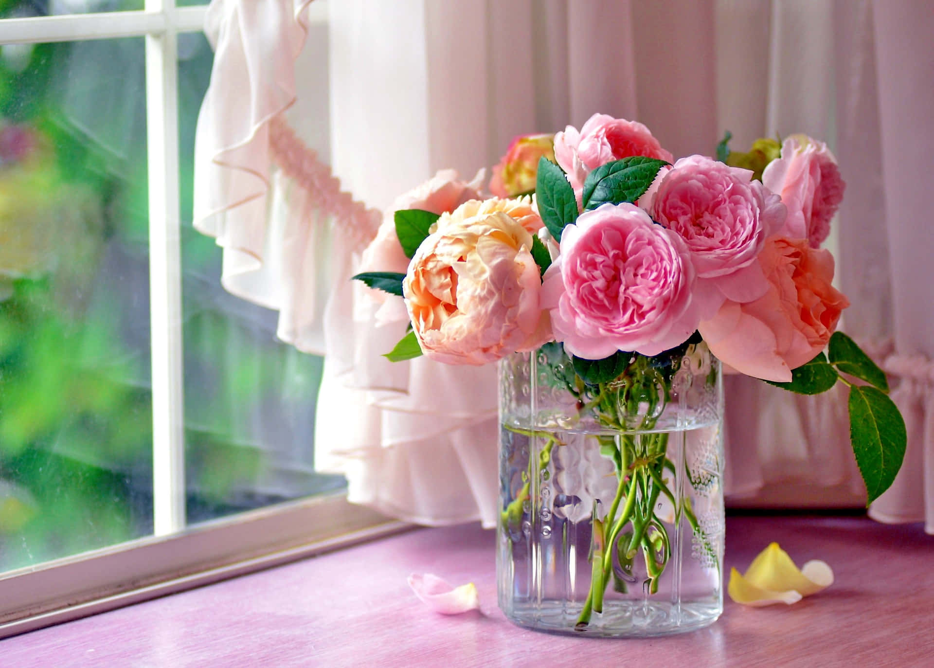 Blooming Rosesin Glass Vase Wallpaper