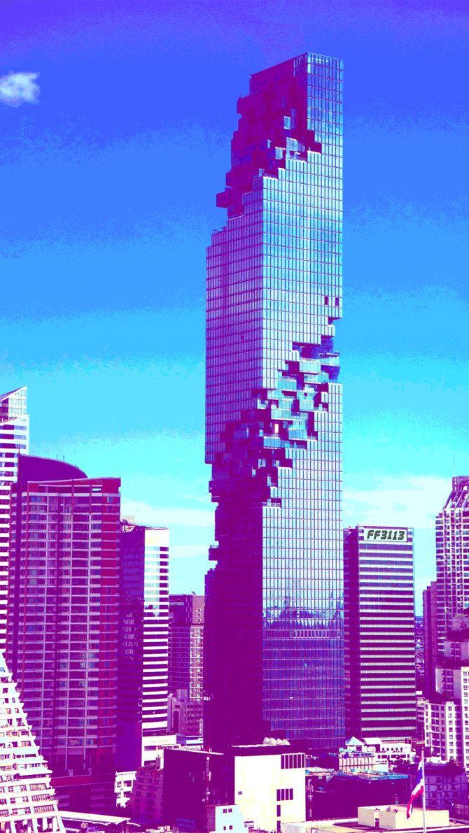 Cool aesthetic wallpaper of modern high and tall buildings under a blue sky. 