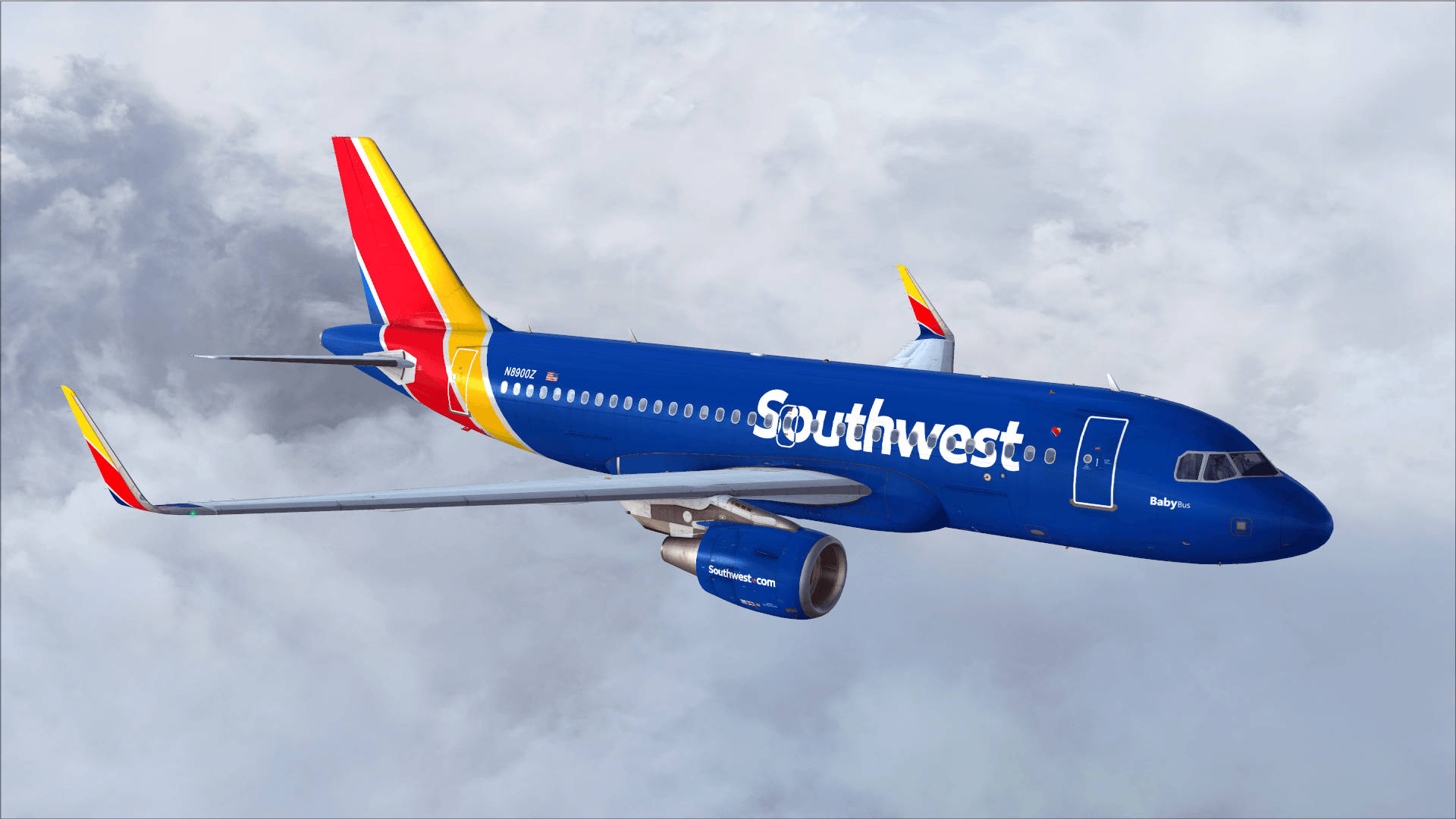Blåt fly fra Southwest Airlines omgivet af lys blå himmel Wallpaper