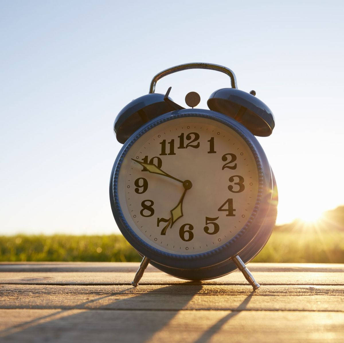 Blue Alarm Clock Telling Time Wallpaper