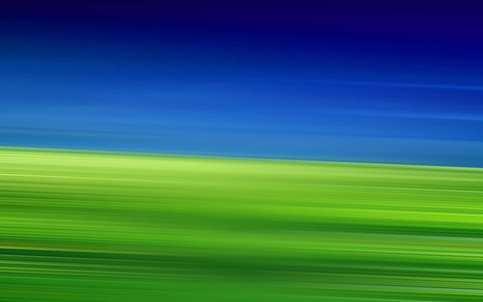 Eingrüner Und Blauer Verschwommener Hintergrund Mit Einem Verschwommenen Hintergrund.