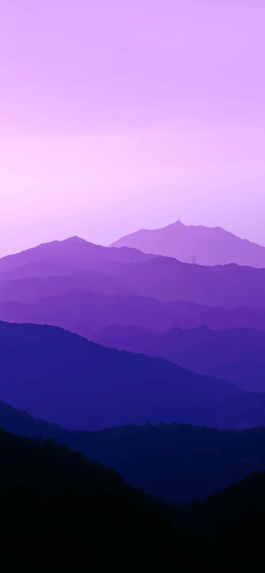Take in the beautiful blue and purple hues of a stunning sunset Wallpaper