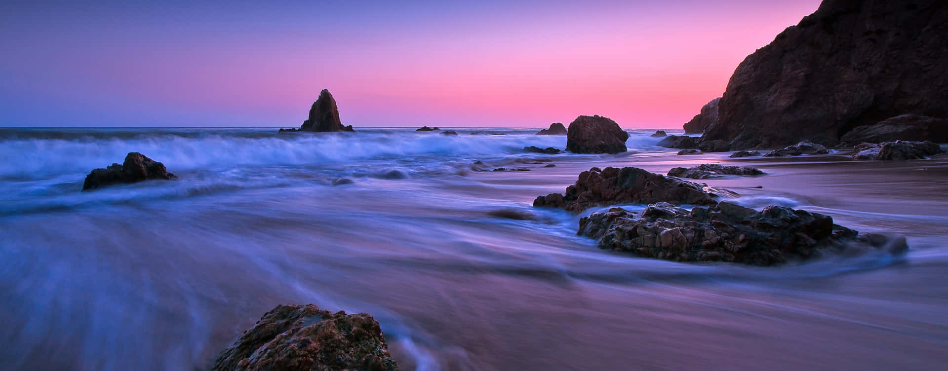 Take in the beauty of a blue and purple sunset Wallpaper