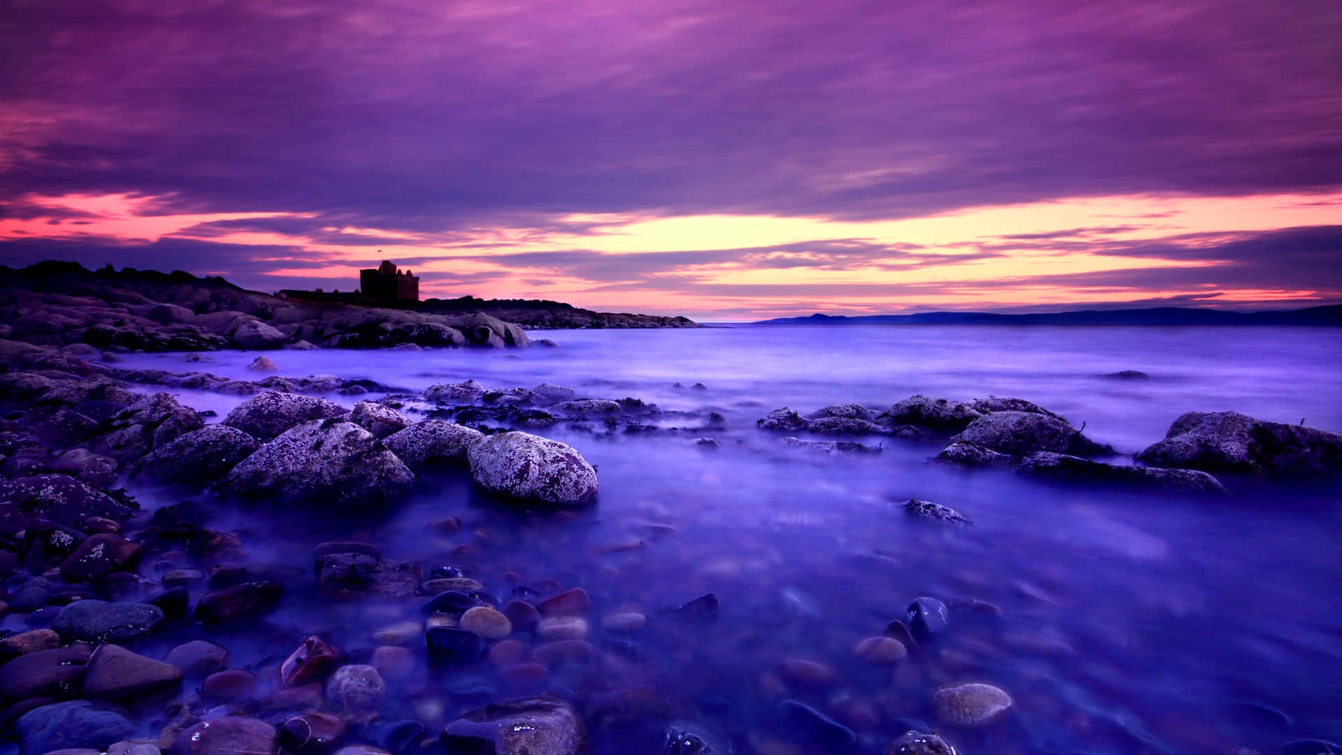 Relish the vivid beauty of a blue and purple sunset Wallpaper