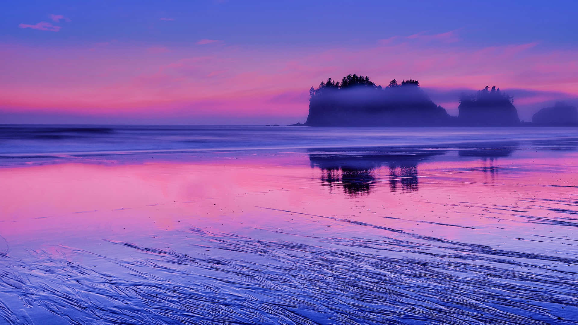 A beautiful sunset of calming hues of blue and purple over the horizon. Wallpaper