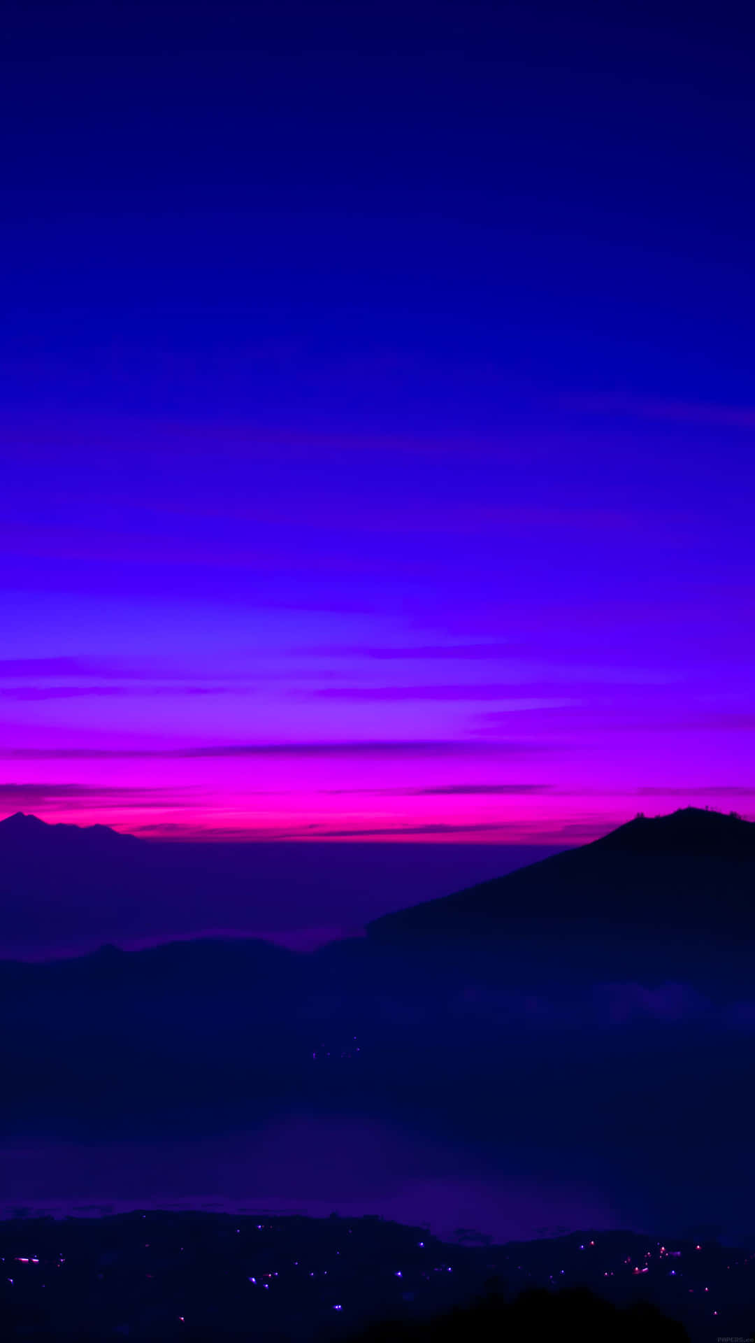 Foggy Mountains On A Blue And Purple Sunset Wallpaper