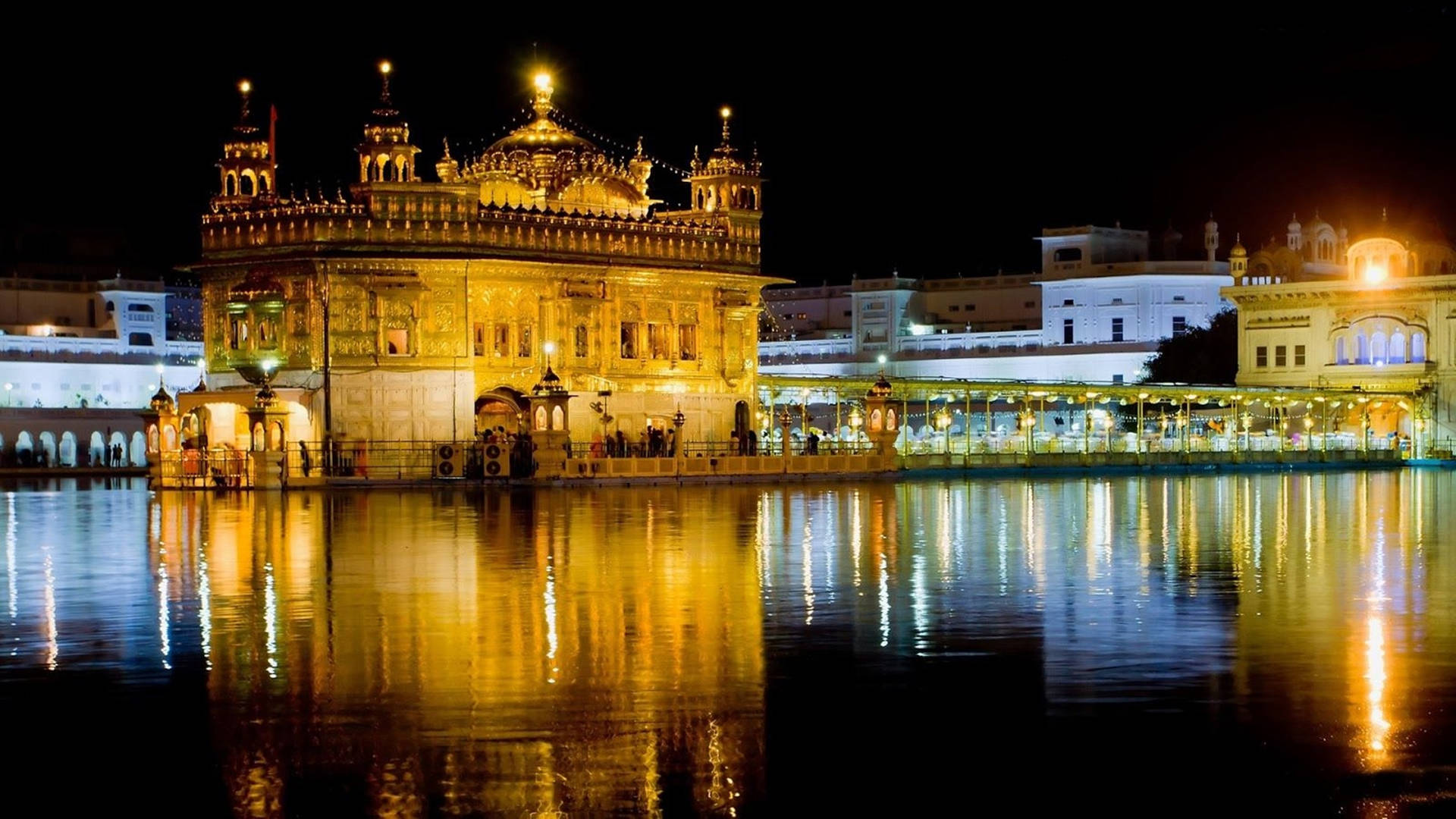 Download Blue And Yellow Lights On Golden Temple Hd Wallpaper | Wallpapers .com
