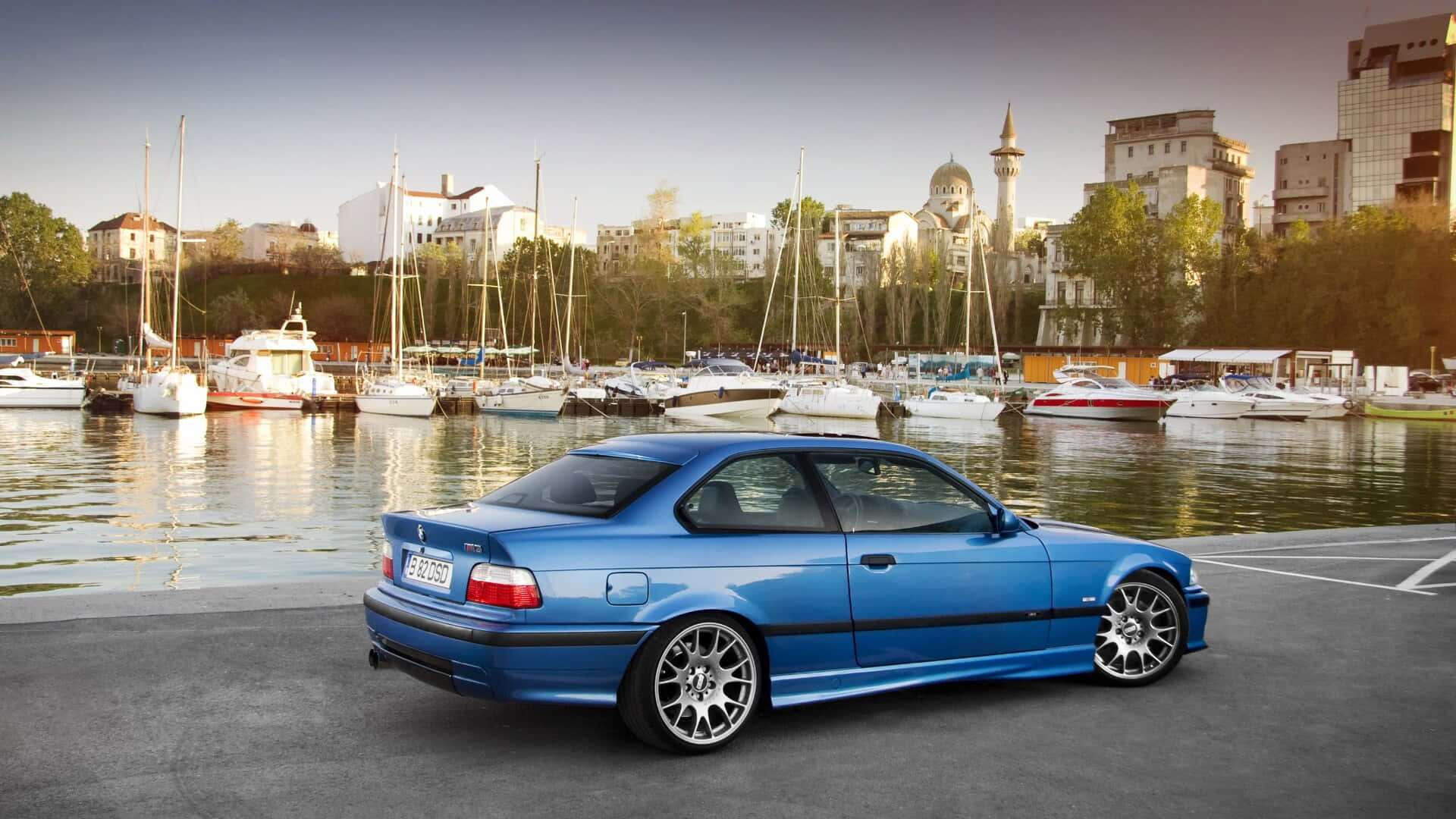 Blue B M W E36 Coupe Marina Backdrop Wallpaper