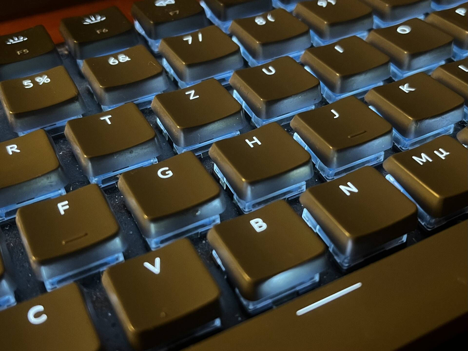 Blue Back Lit Computer Keyboard Background