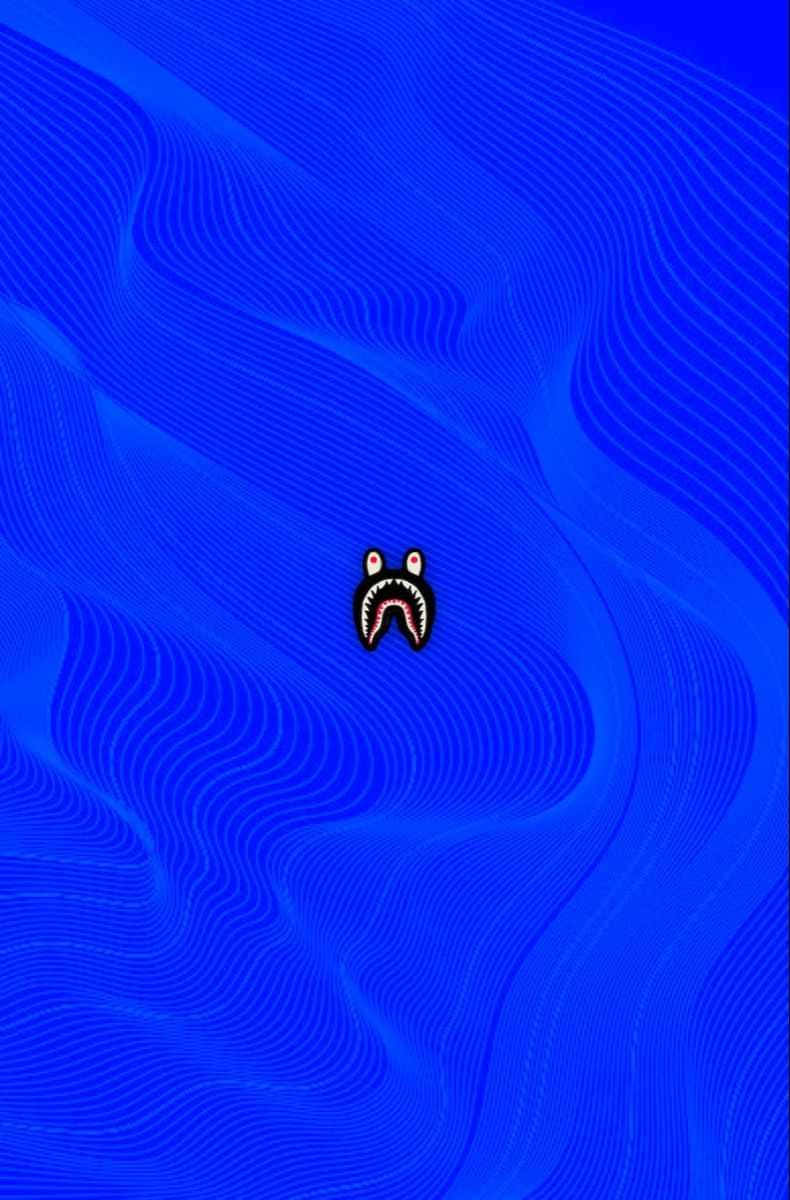 A Blue Background With A Black Face On It Wallpaper