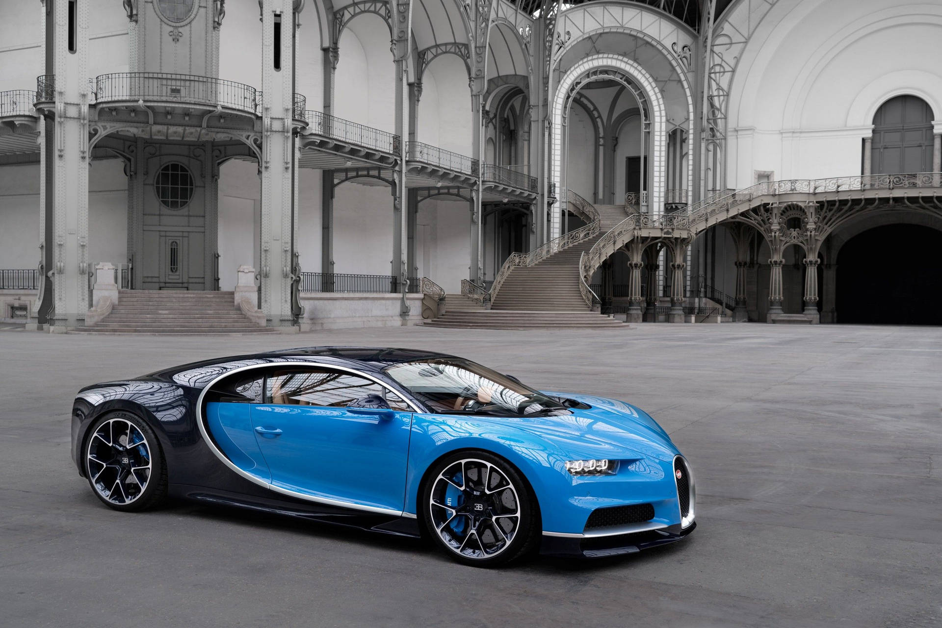 Blue Bugatti In Gray Town Wallpaper