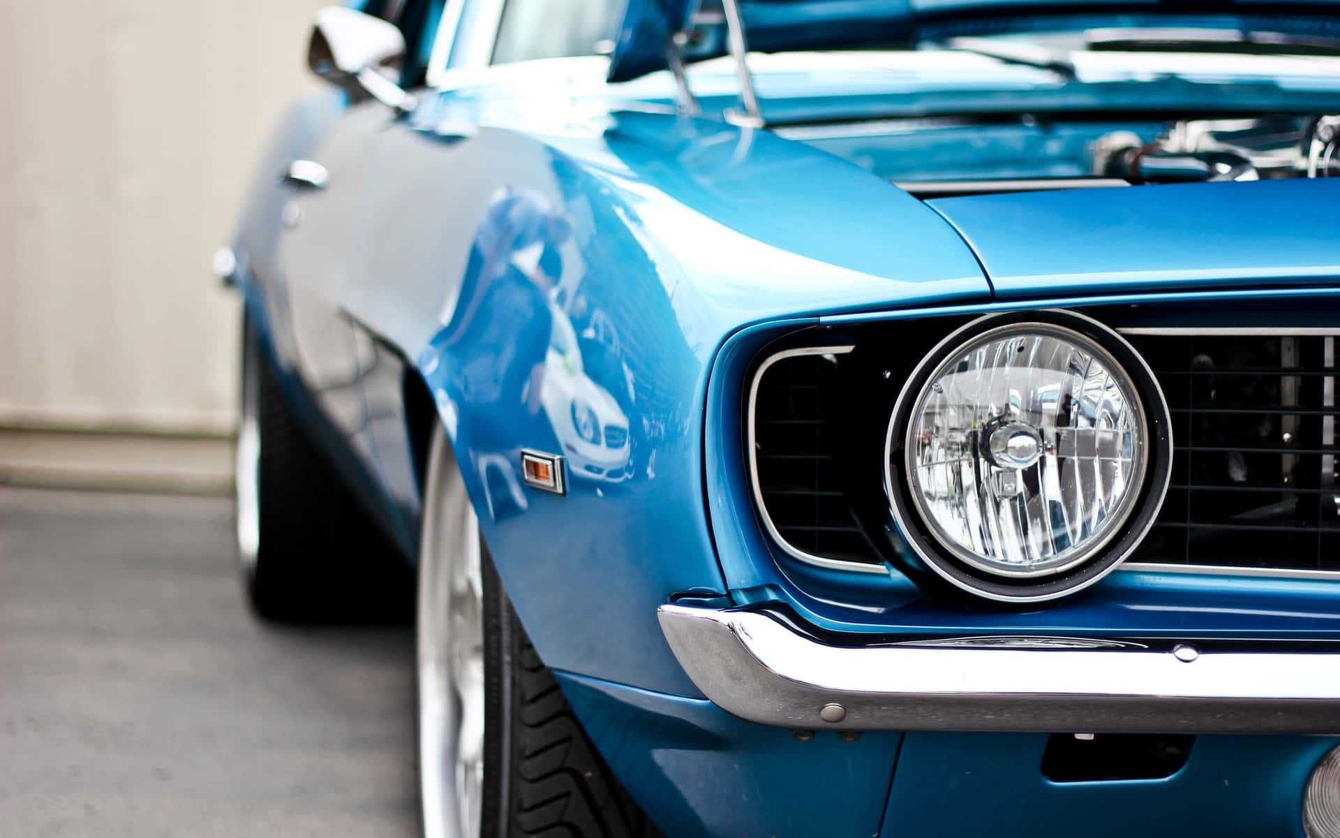A Blue Muscle Car With The Hood Open Wallpaper