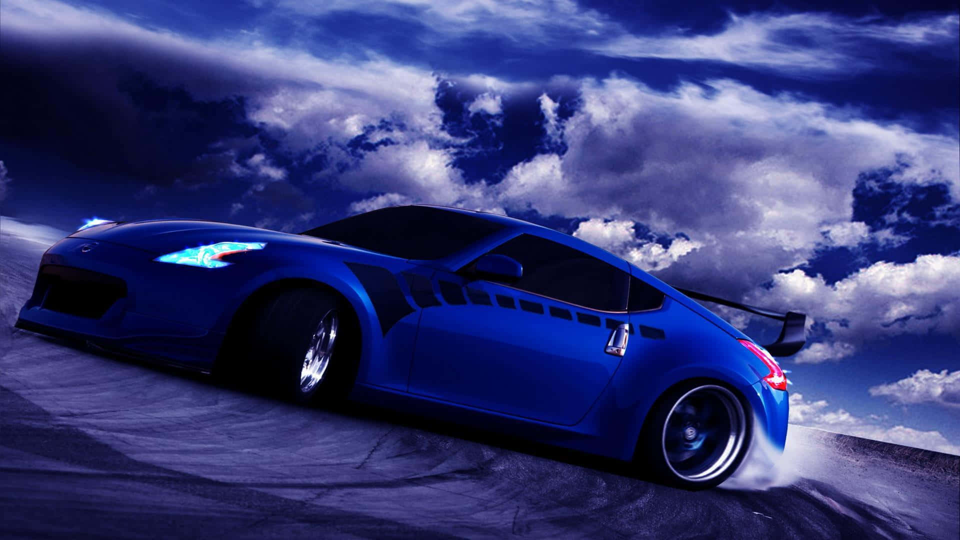 A Blue Sports Car Driving Down A Road With Clouds In The Background Wallpaper