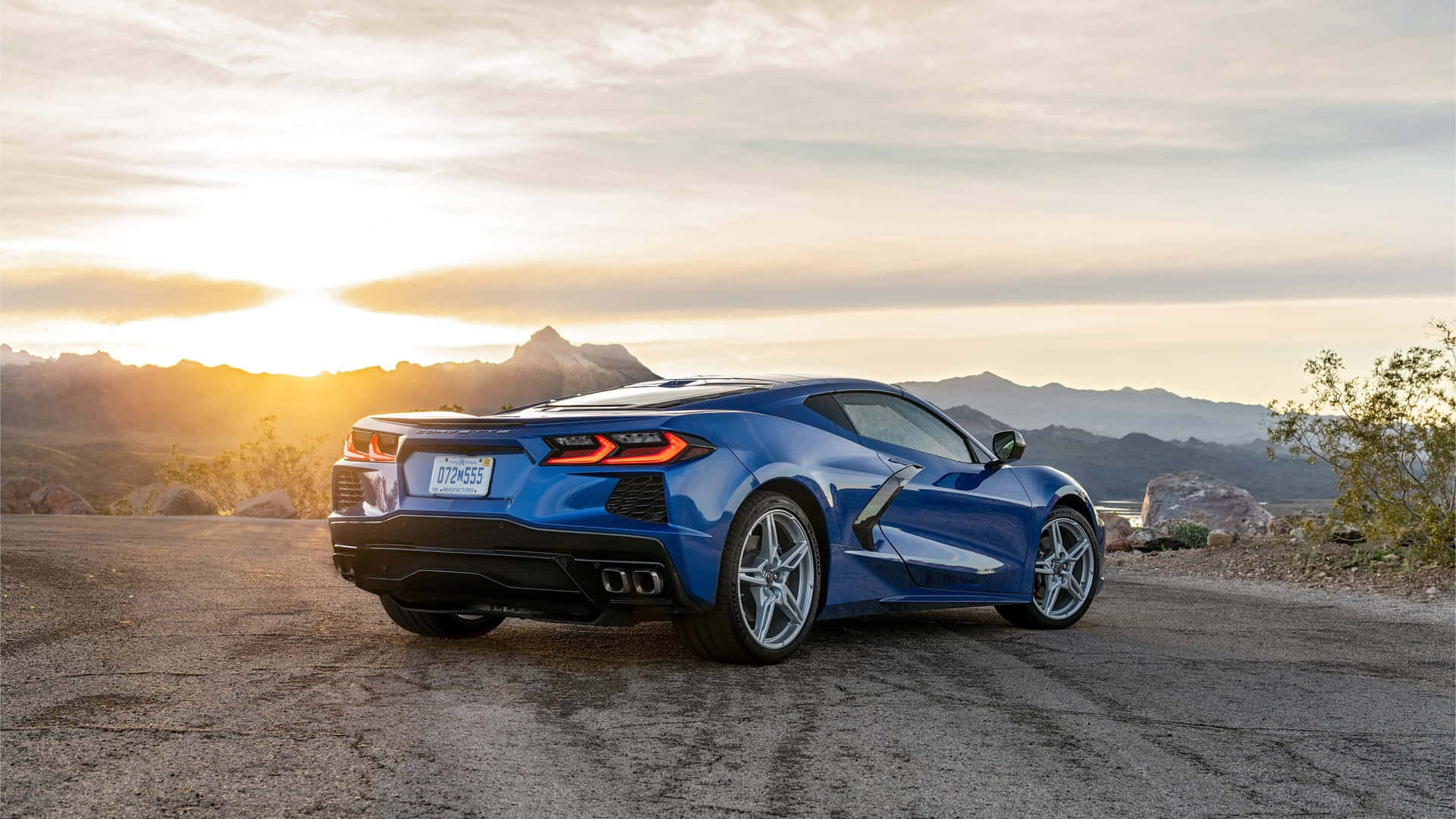 Blue Corvette C8 Sunset Backdrop Wallpaper