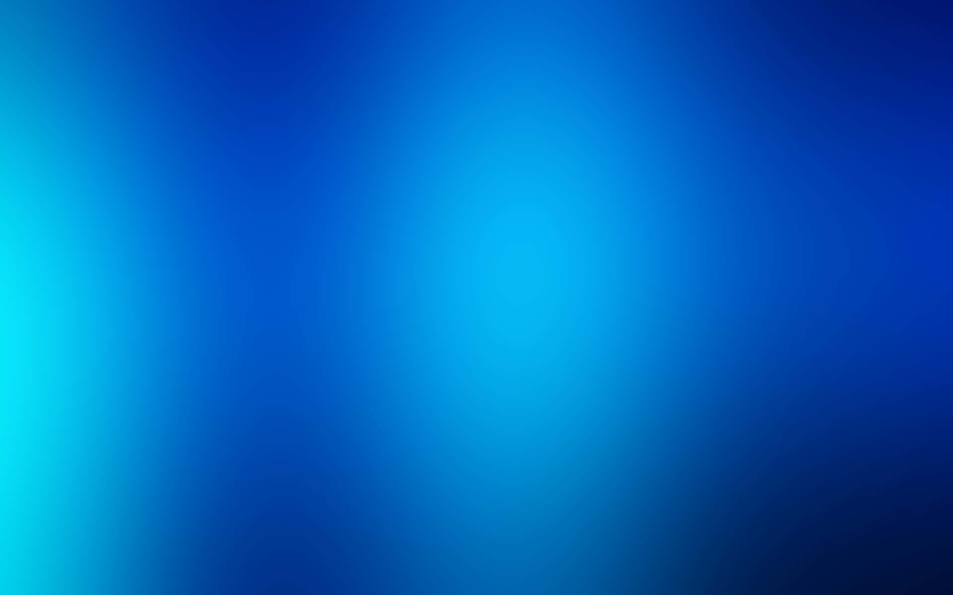 A blue desktop illuminated with natural light Wallpaper