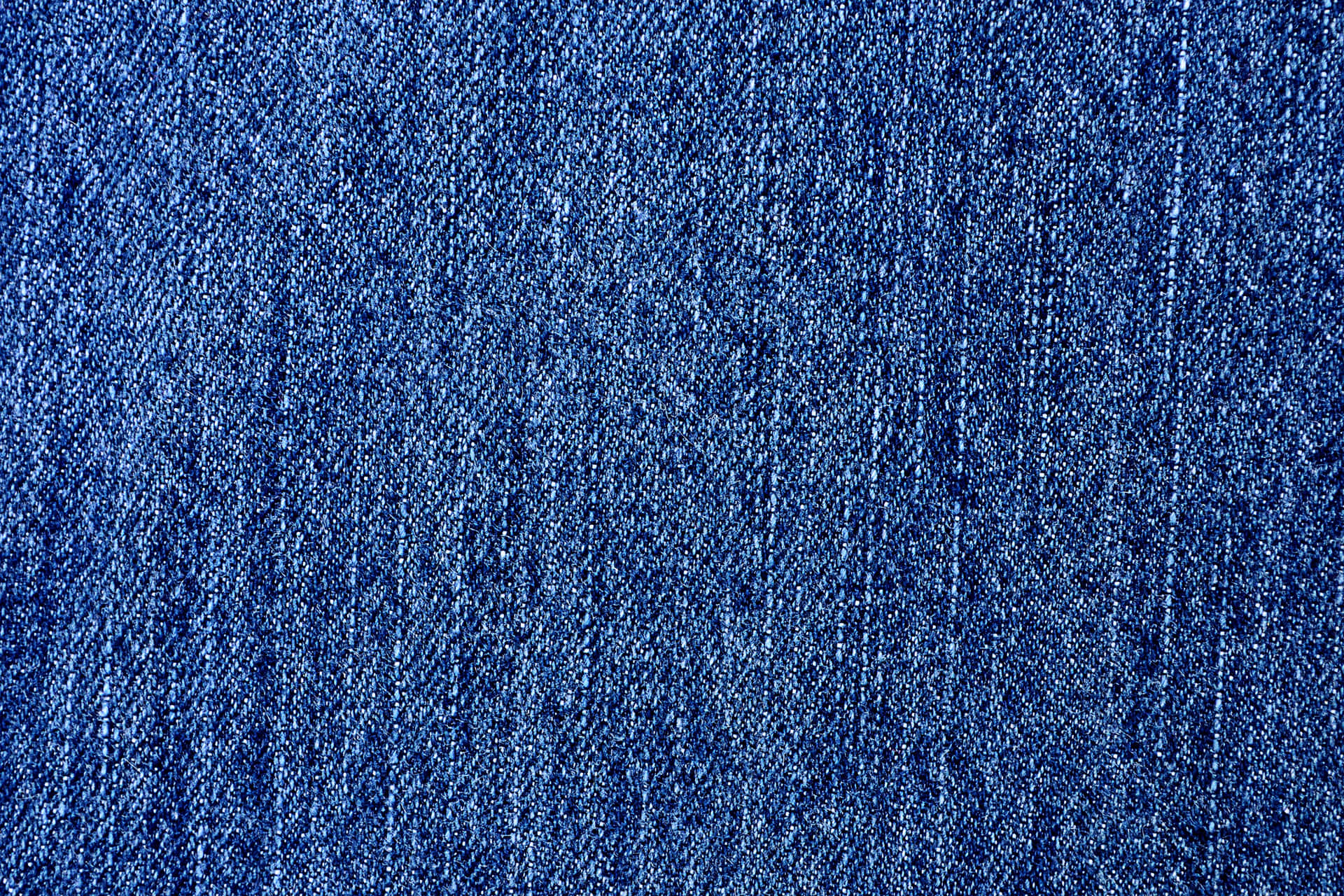 A Close Up Of A Blue Denim Fabric Wallpaper