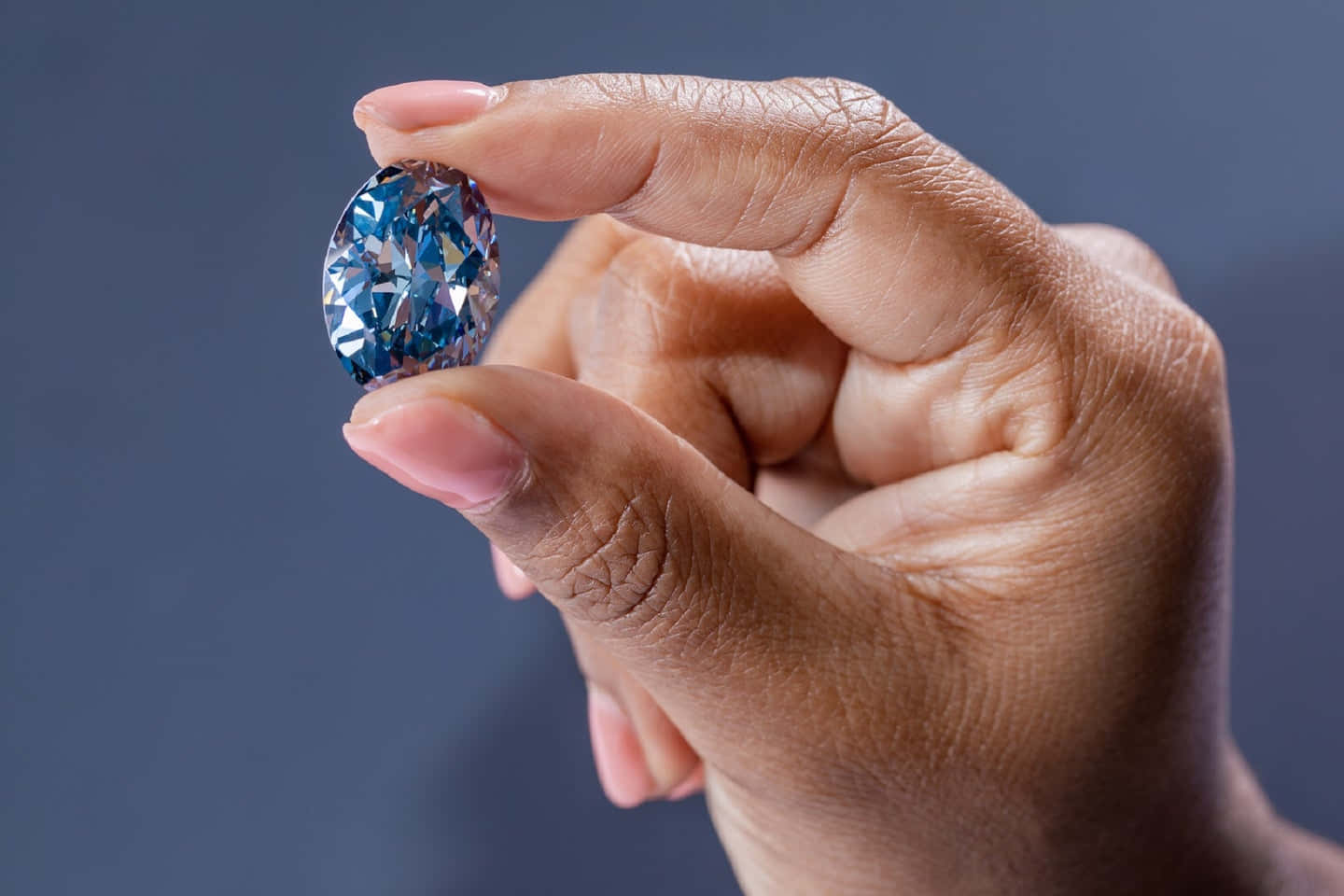 Stunning blue diamonds sparkling against a dark background