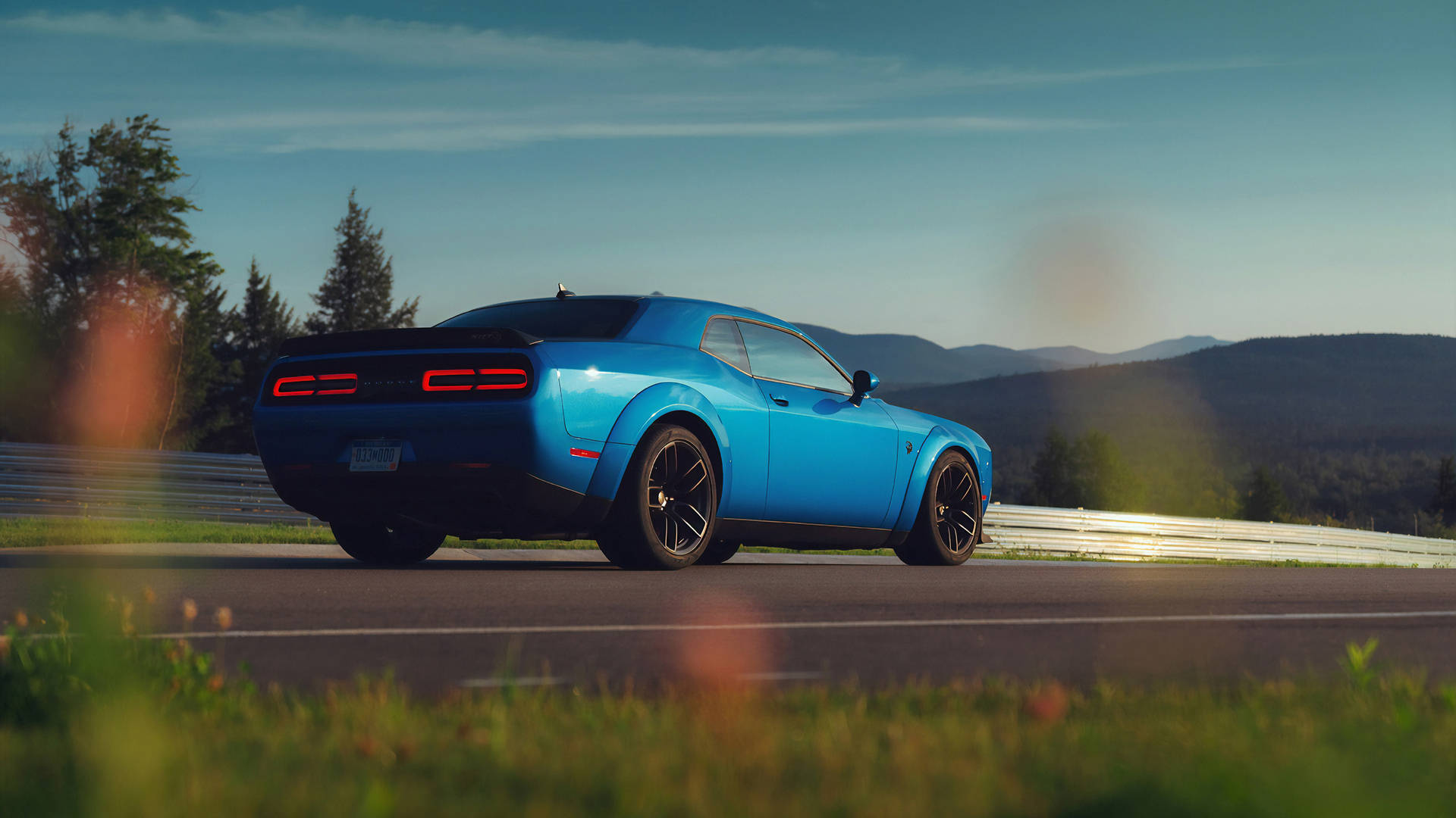 Blue Dodge Challenger On A Road Trip Wallpaper