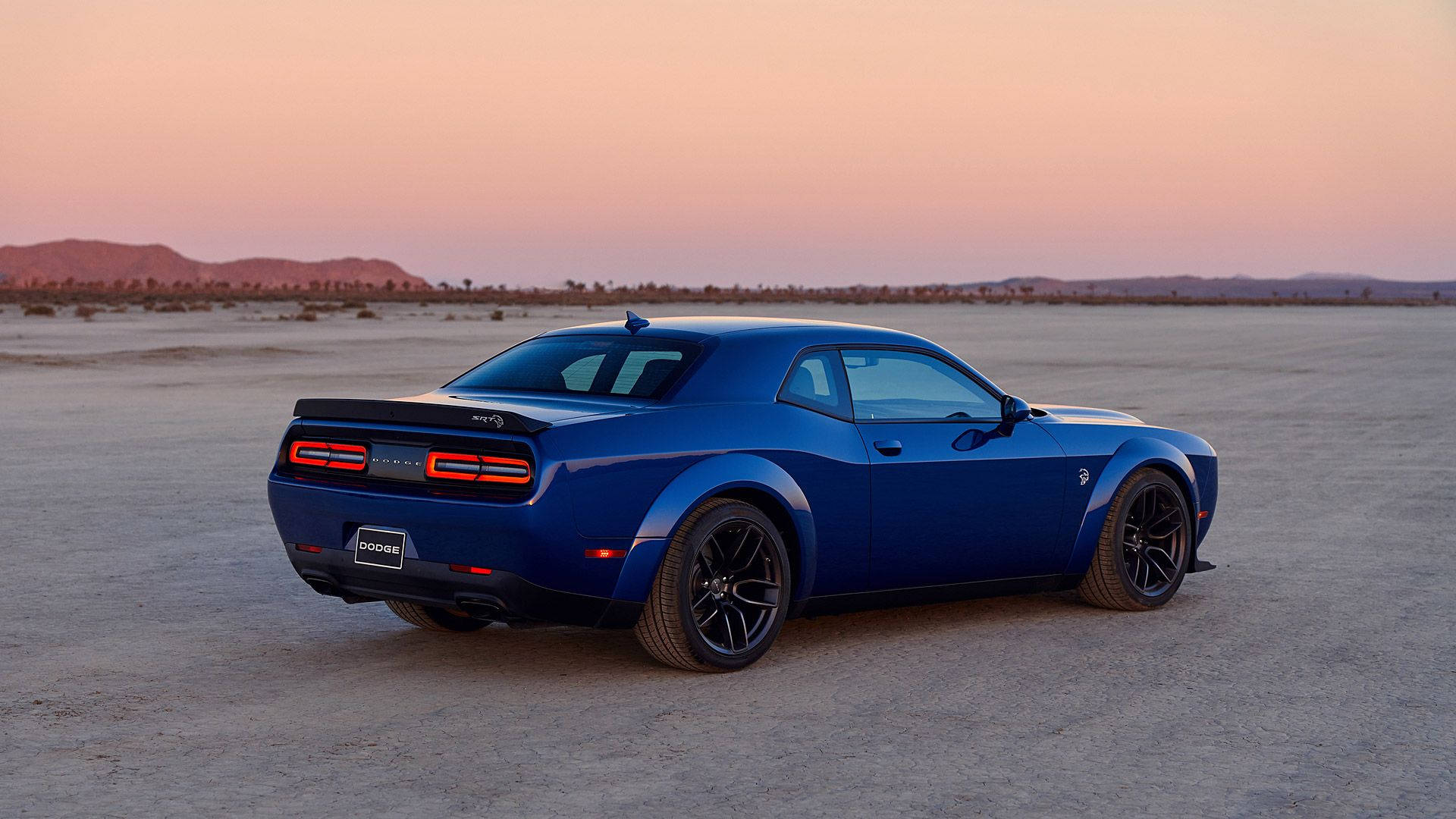 Blue Dodge Challenger On Sandy Road Background