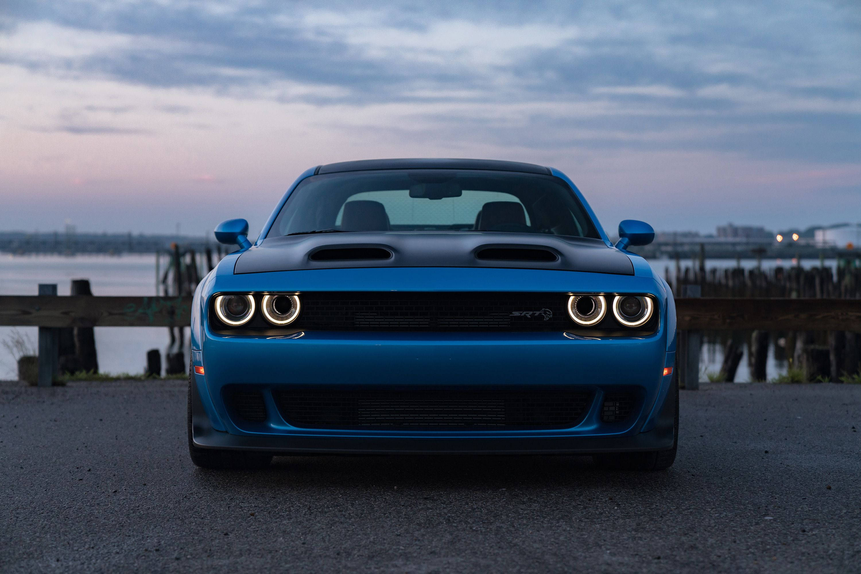 Majestic Blue Dodge Challenger Overlooking the Bay Wallpaper