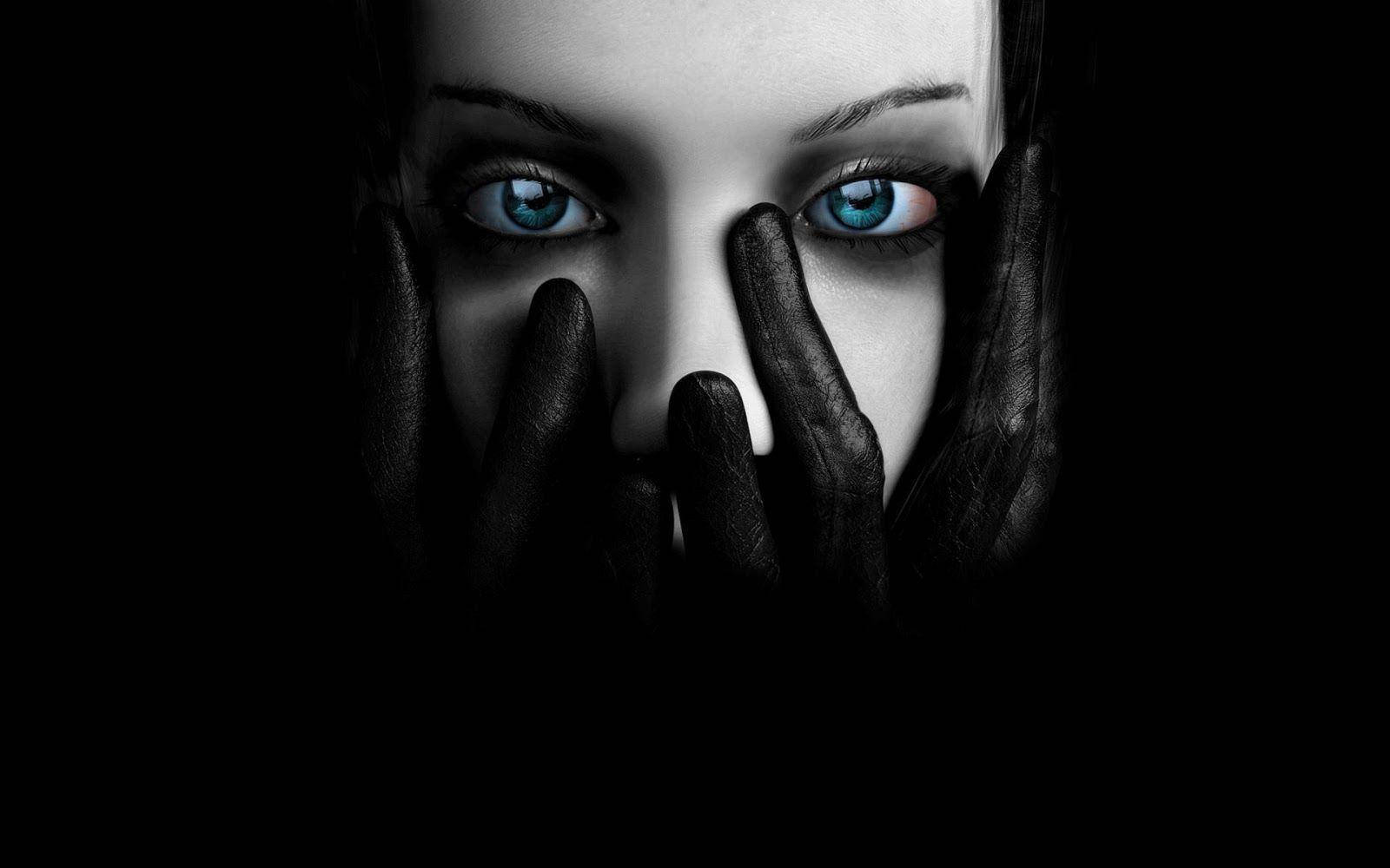 Blue-eyed Woman Over Dark Screen Wallpaper