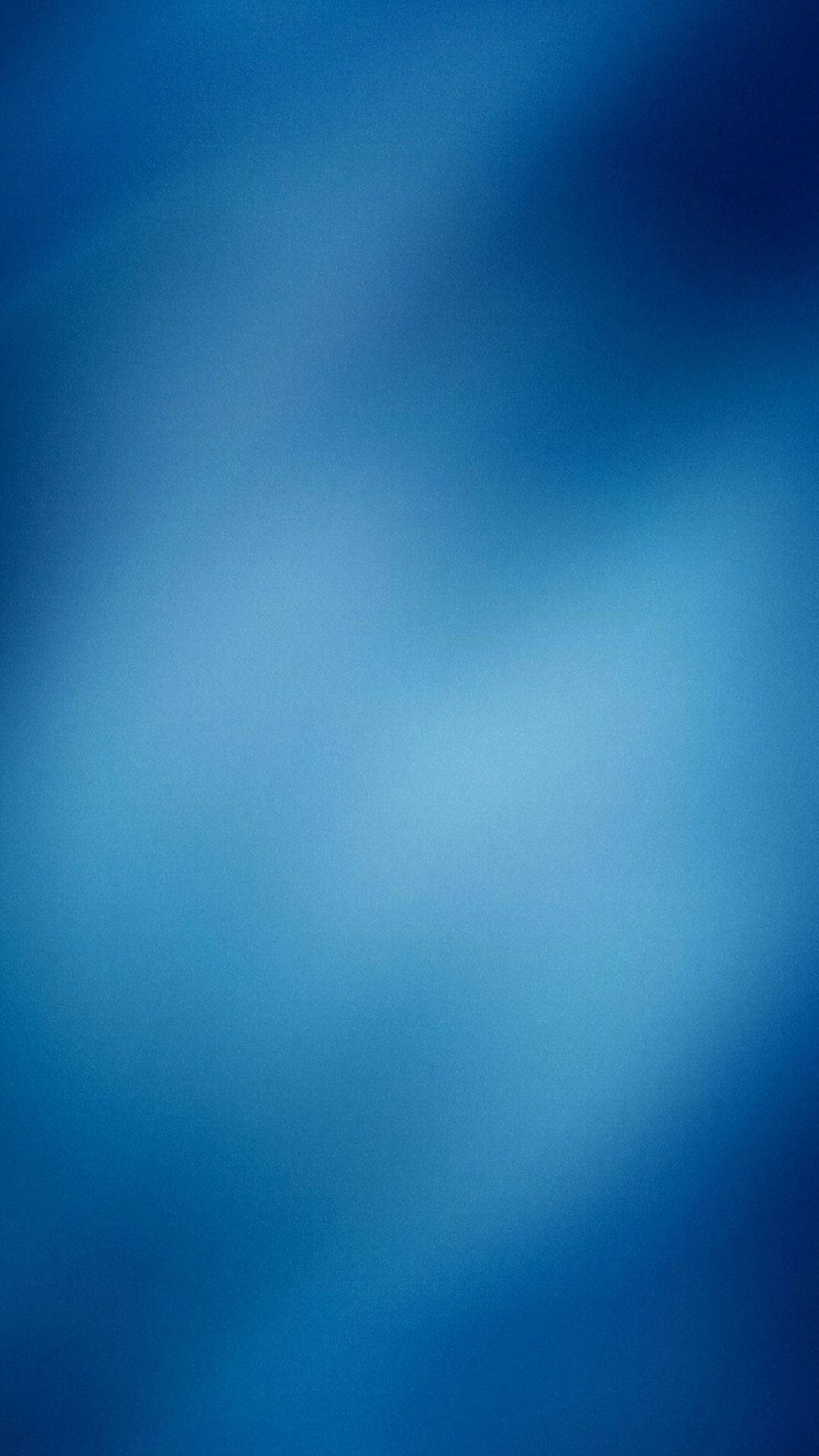 A Blue Background With A Blurred Background Wallpaper