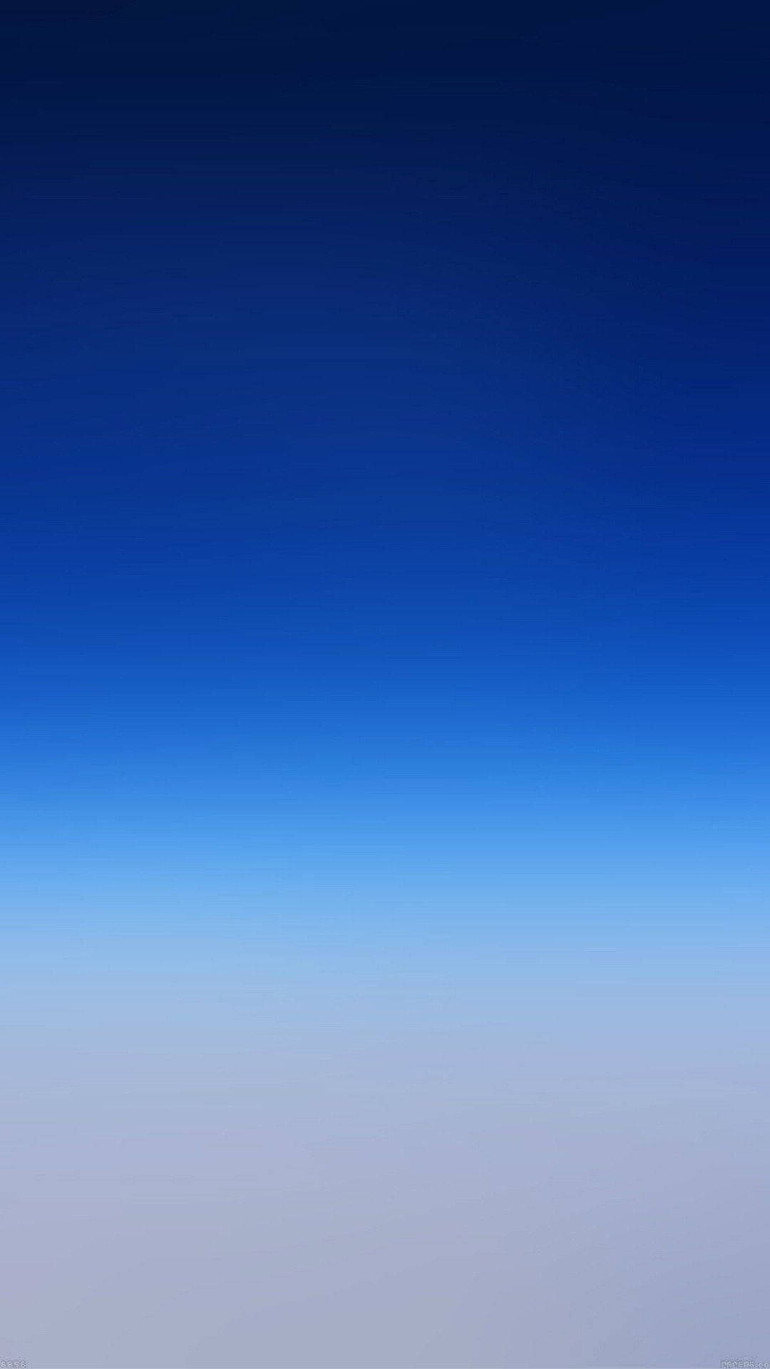 A Blue Sky With Clouds And A Plane Flying Over It Wallpaper