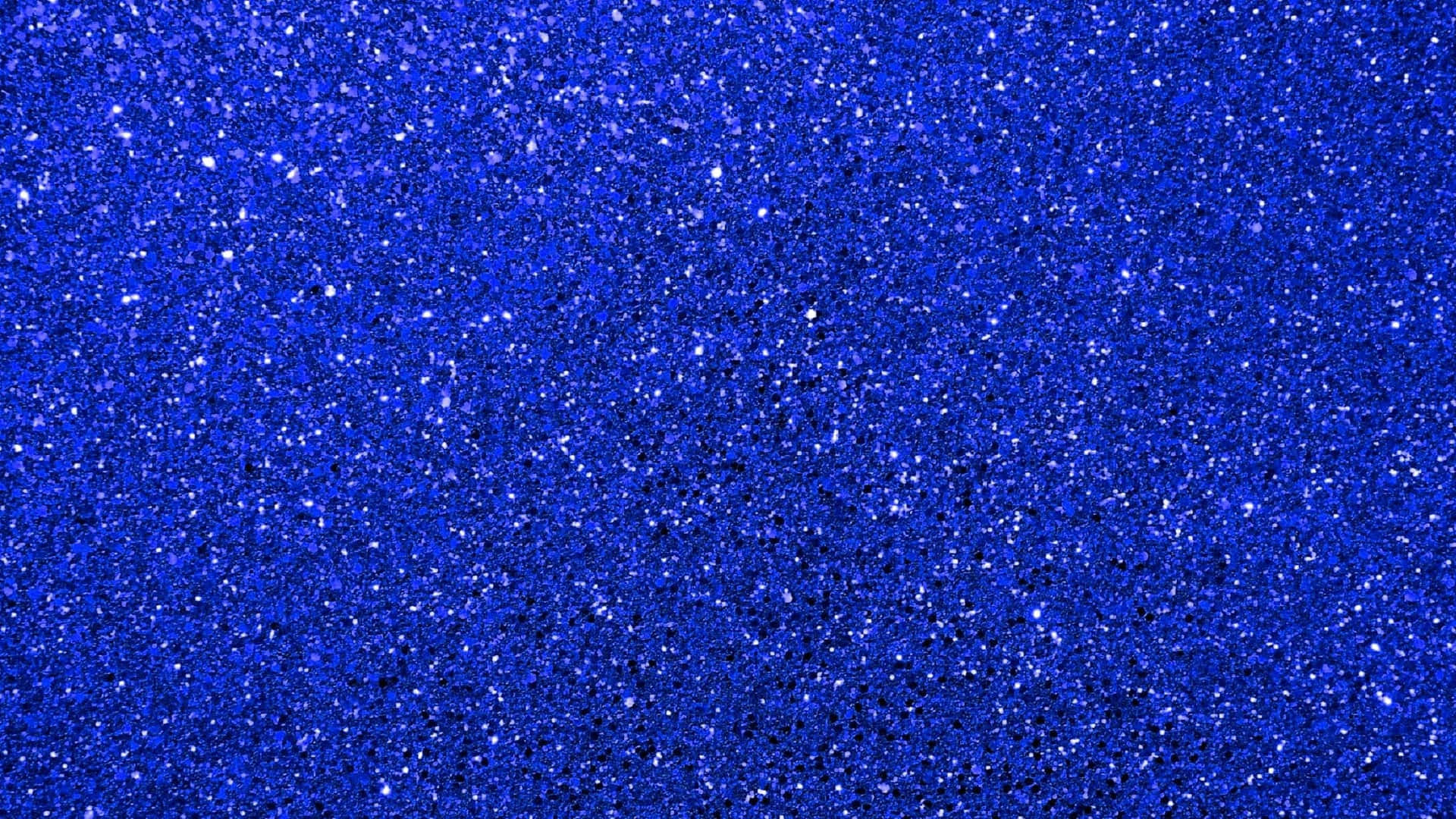 A Blue Glitter Background With A Lot Of Sparkles