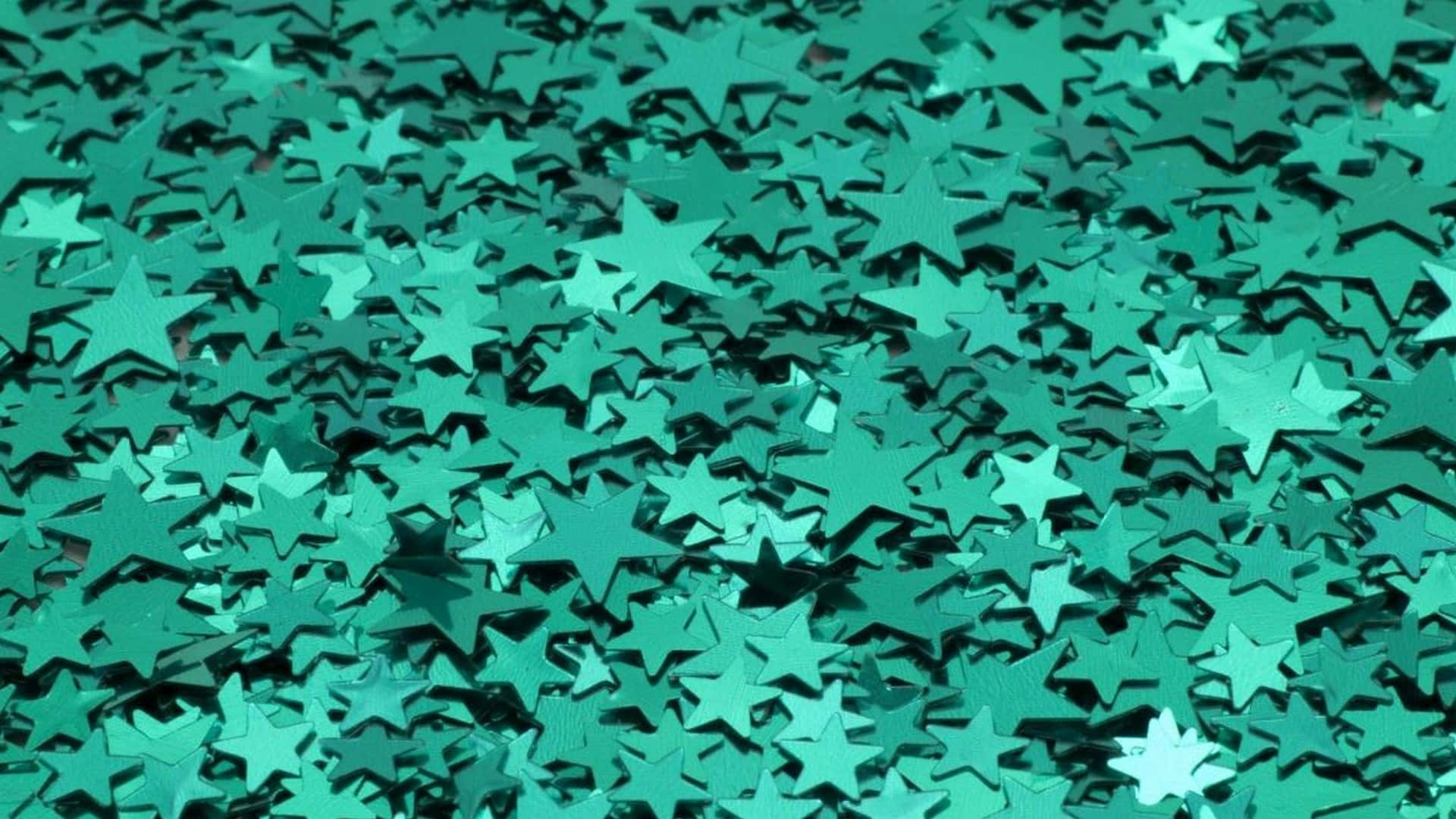 Estéticaen Tonos Azules Y Verdes Con Una Pila De Estrellas. Fondo de pantalla