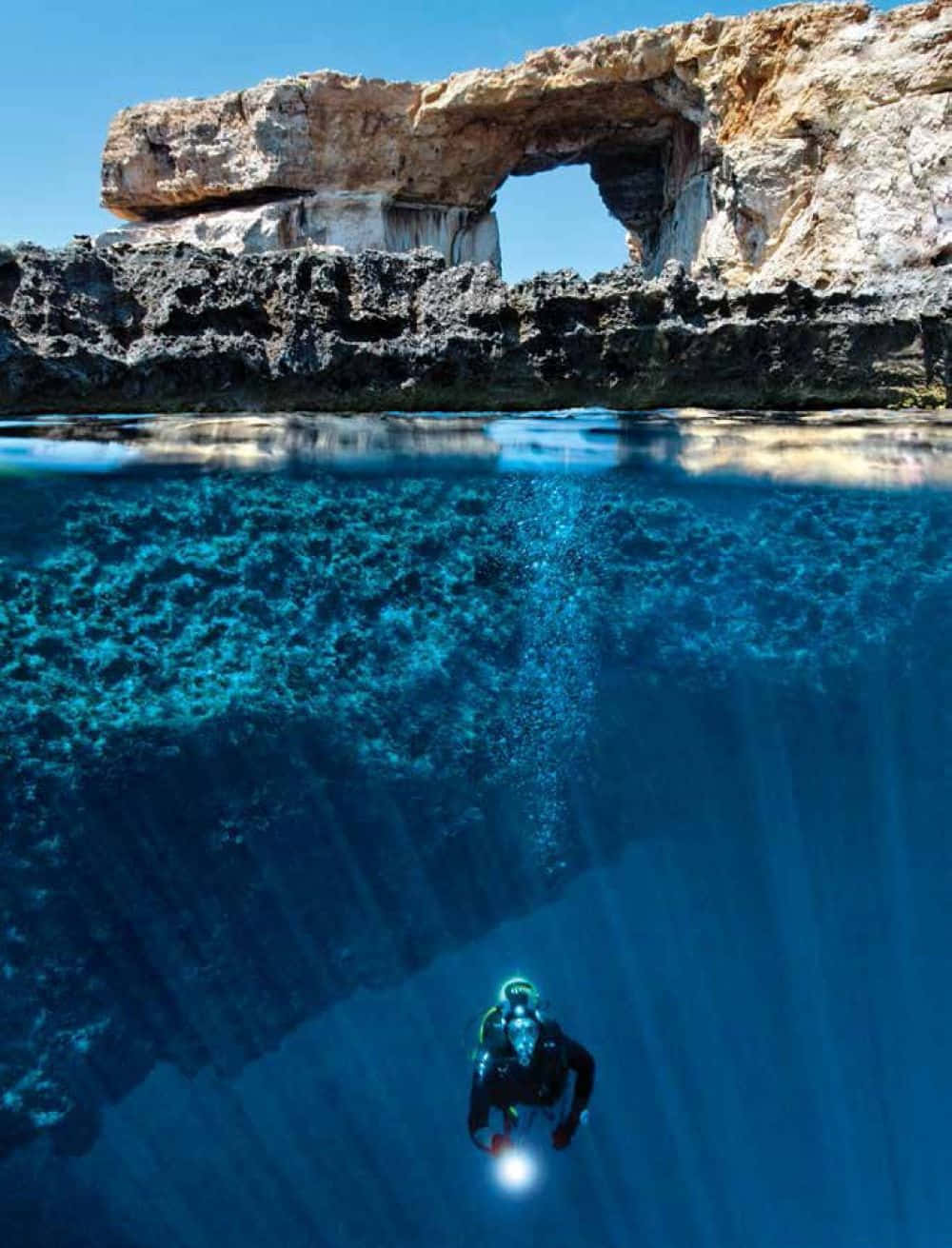 Exploring the Mysterious Depths of a Blue Hole Wallpaper