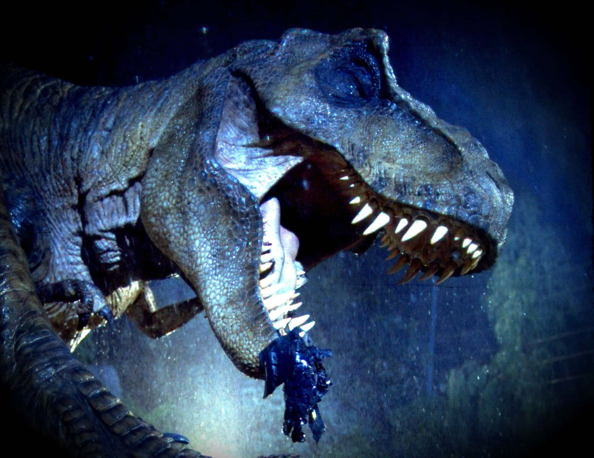 Jurassic World kommer til live i magiske blå og grønne toner. Wallpaper