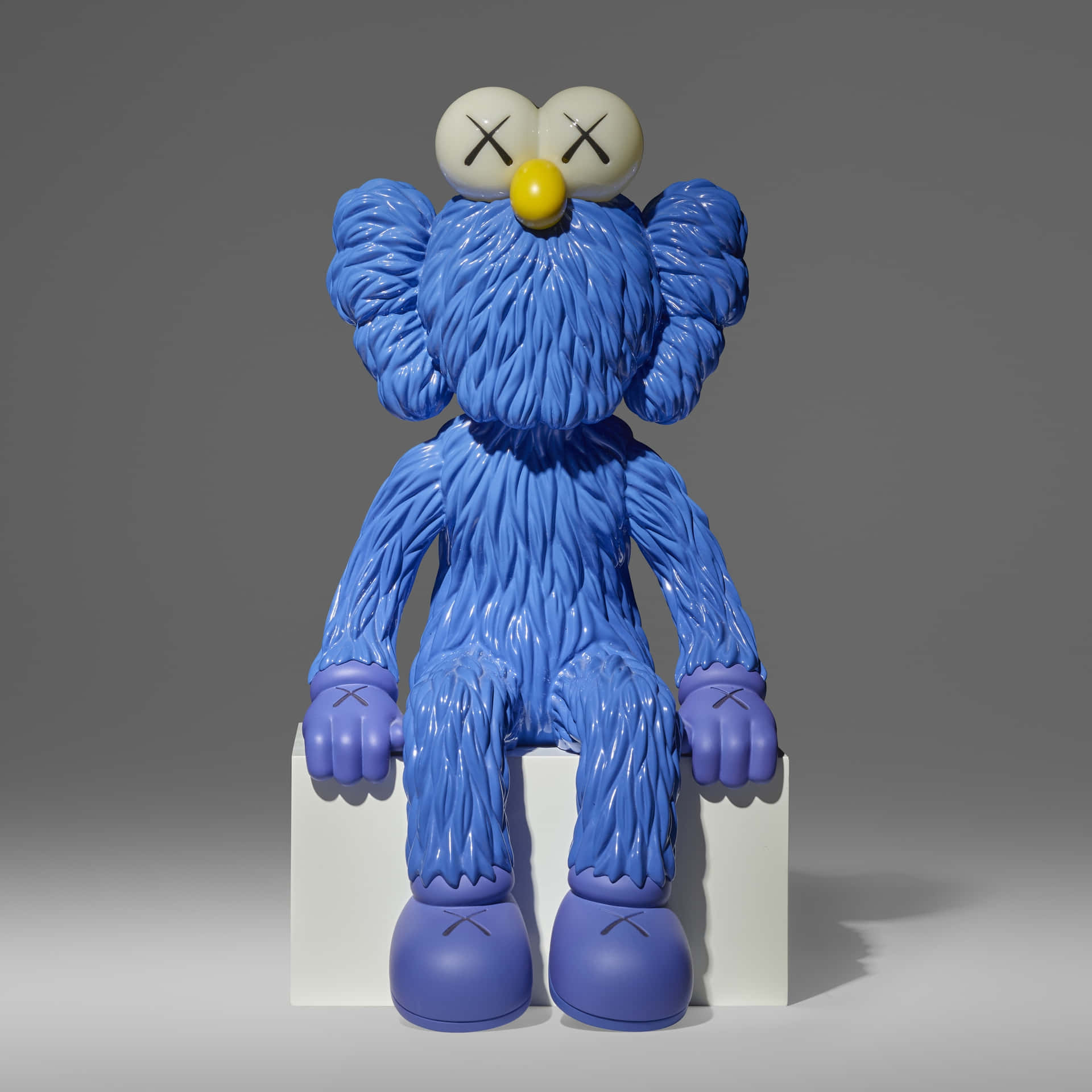 Blue Kaws Figure Sitting Wallpaper