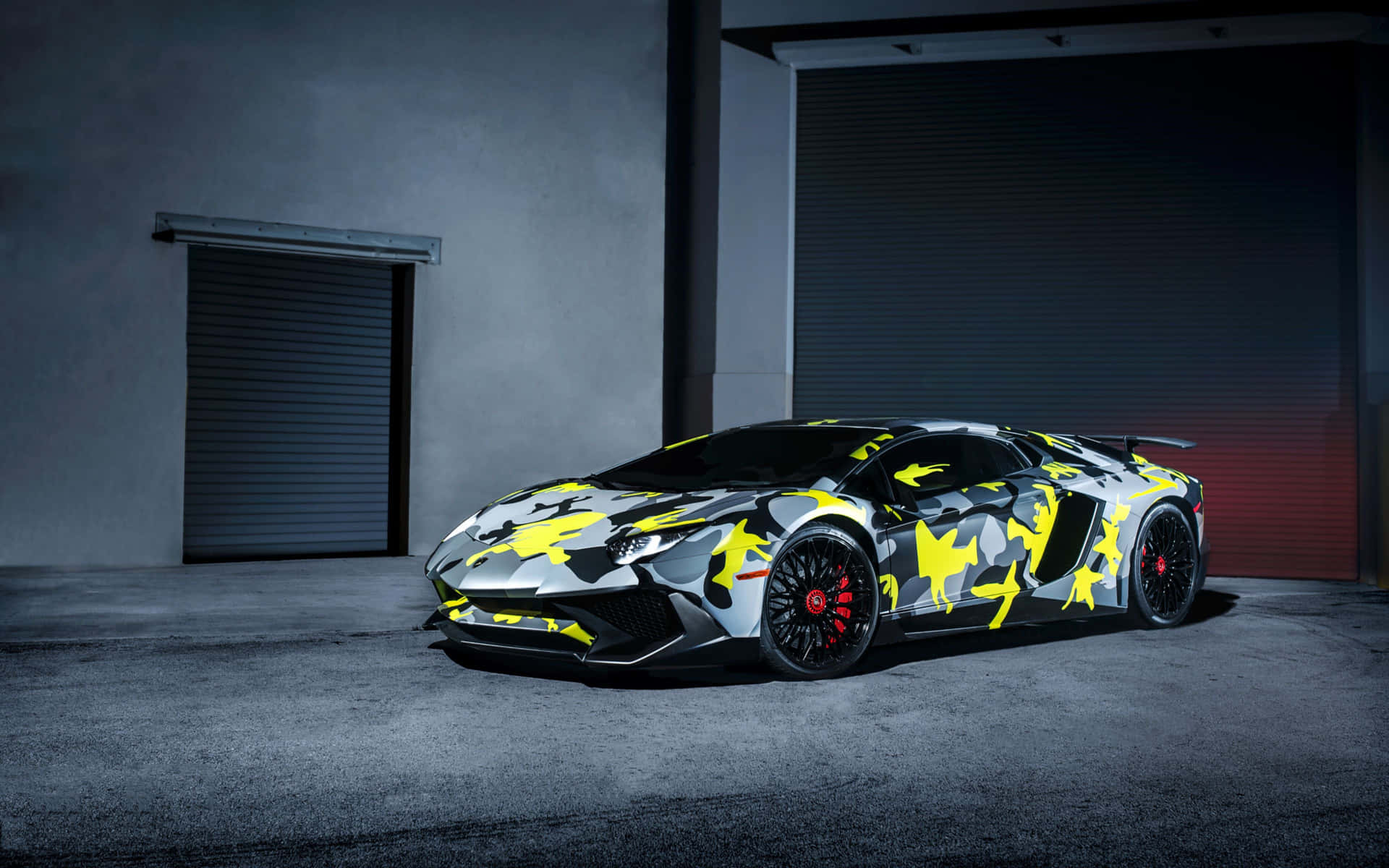 a lamborghini huracan is parked in a garage Wallpaper