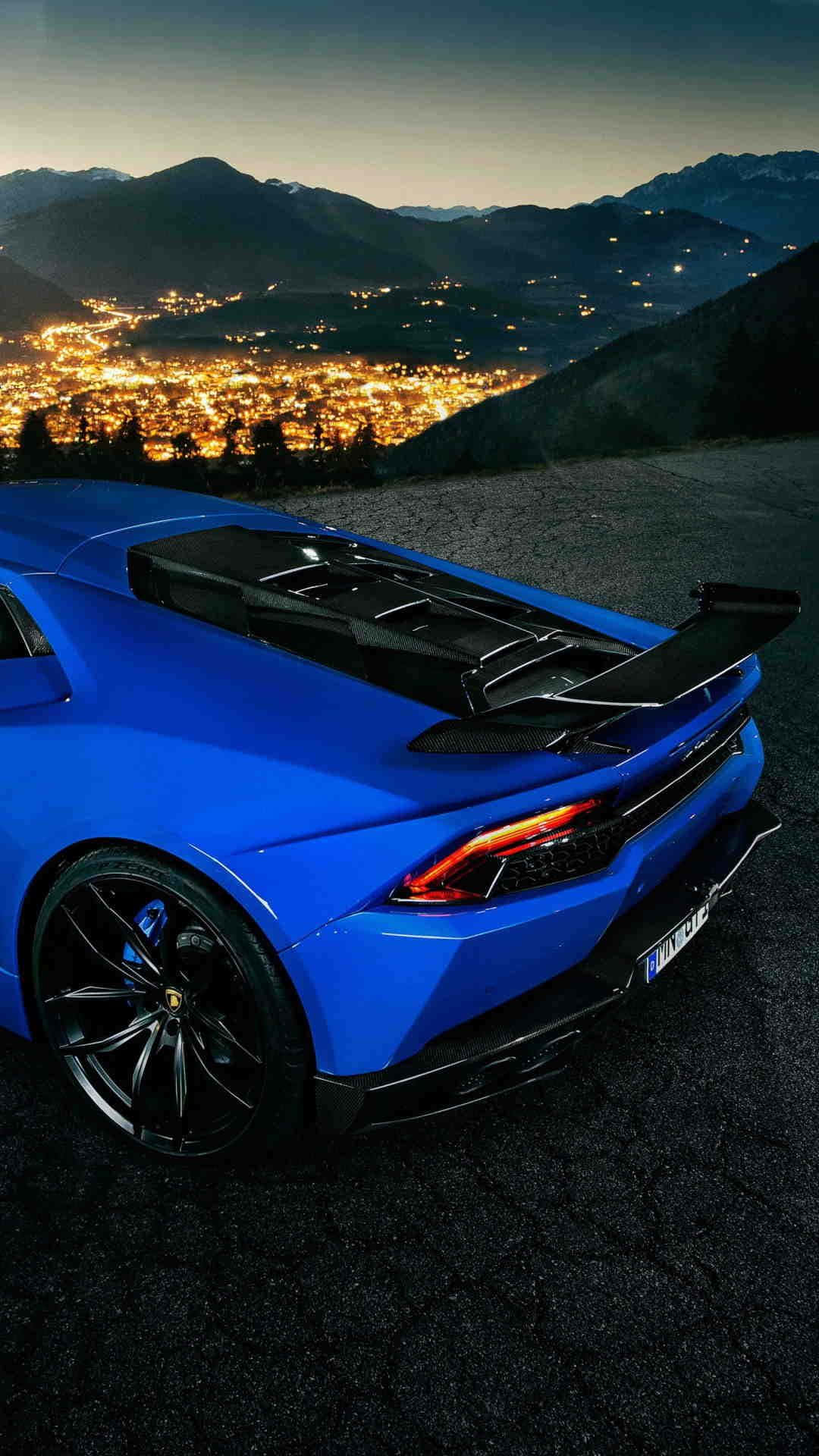 "Take a ride in this blue Lamborghini for a fun and exciting adventure." Wallpaper