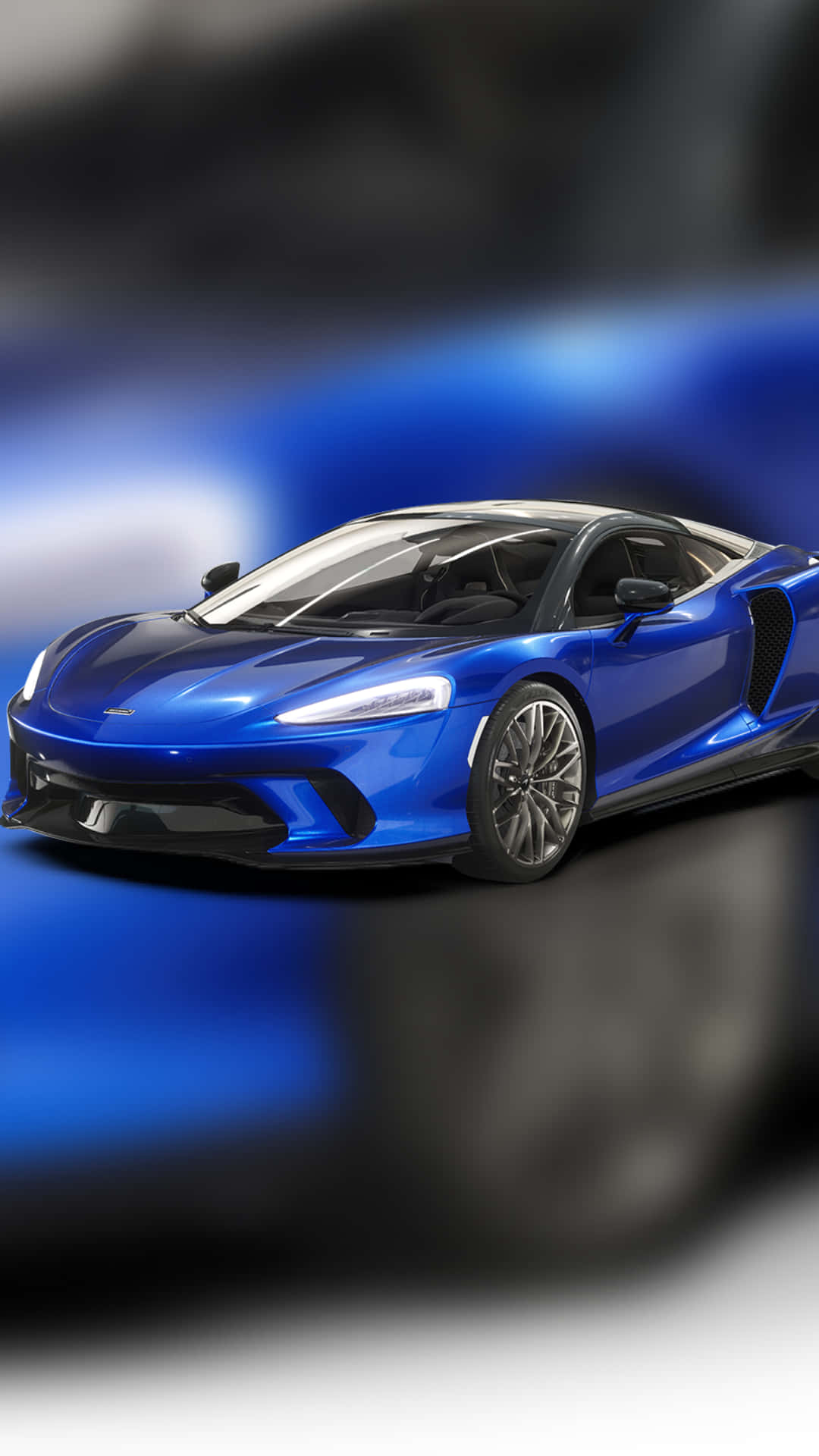 En blå Lamborghini sportsvogn mod en malerisk morgensky. Wallpaper