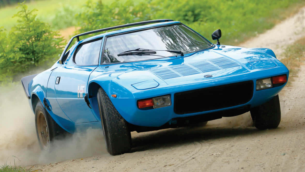 Blauwe Lancia Stratos Rallyend Op Grind Achtergrond