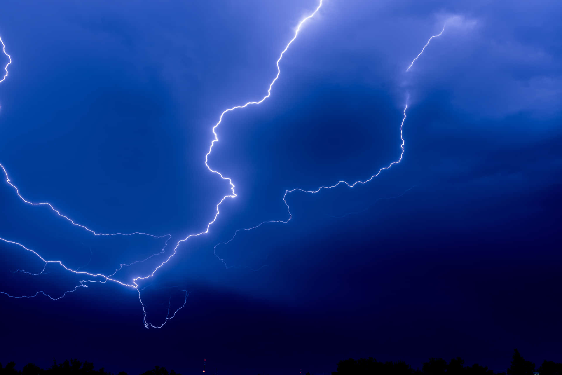 "A bolt of blue lightning flashes through the sky."