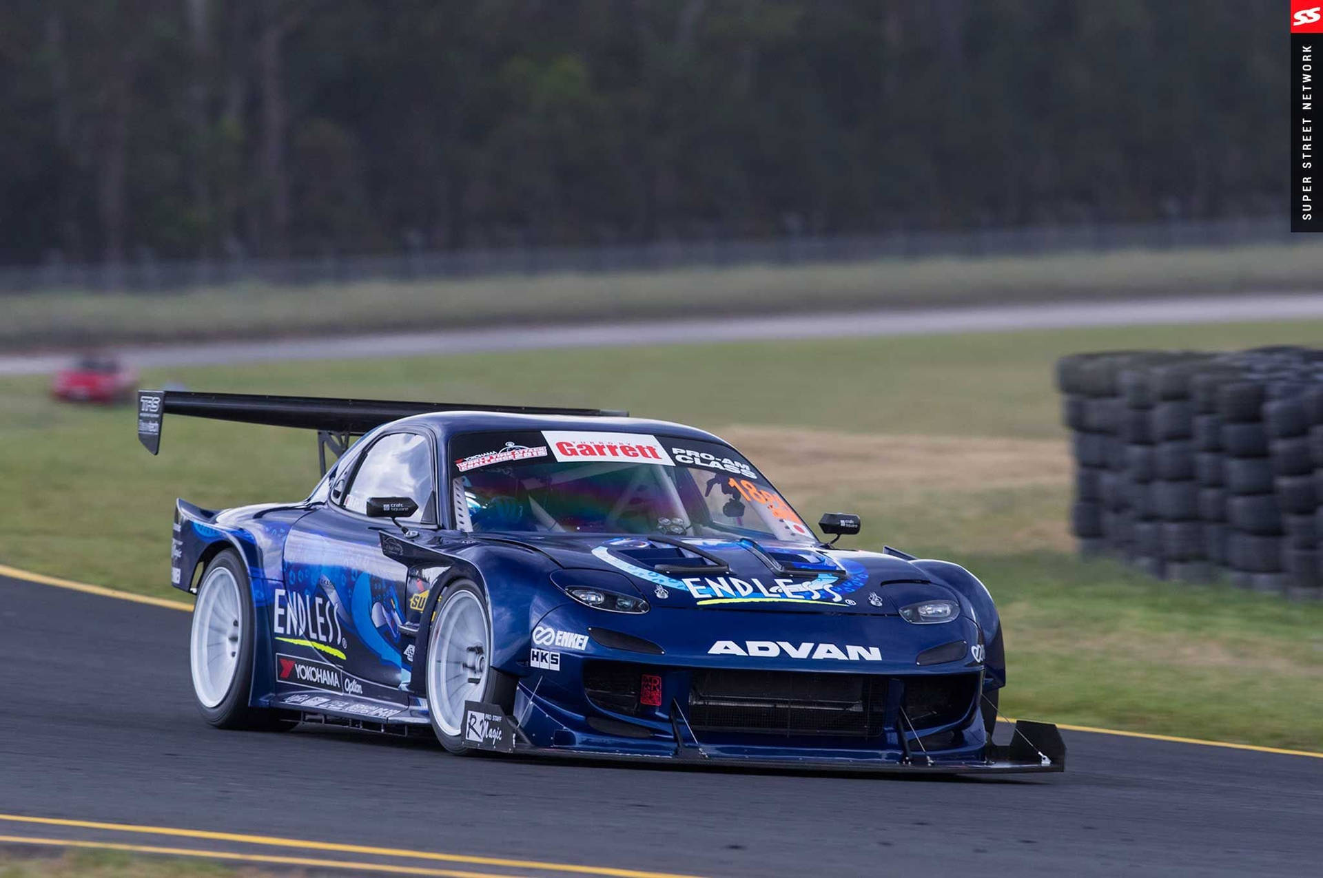 Blue Mazda Rx7 Race Track