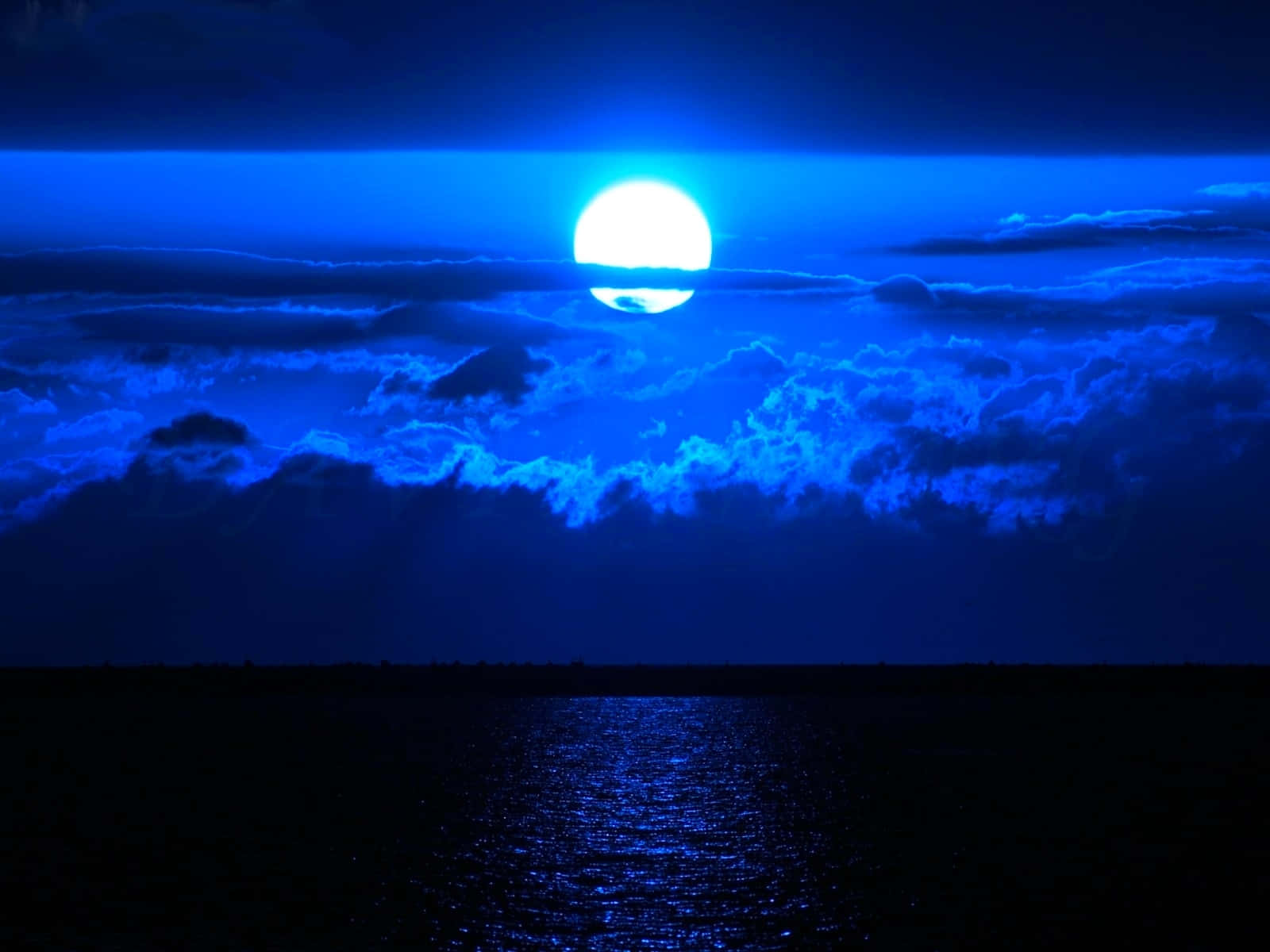 Blue Moon Over Ocean Night Sky Wallpaper