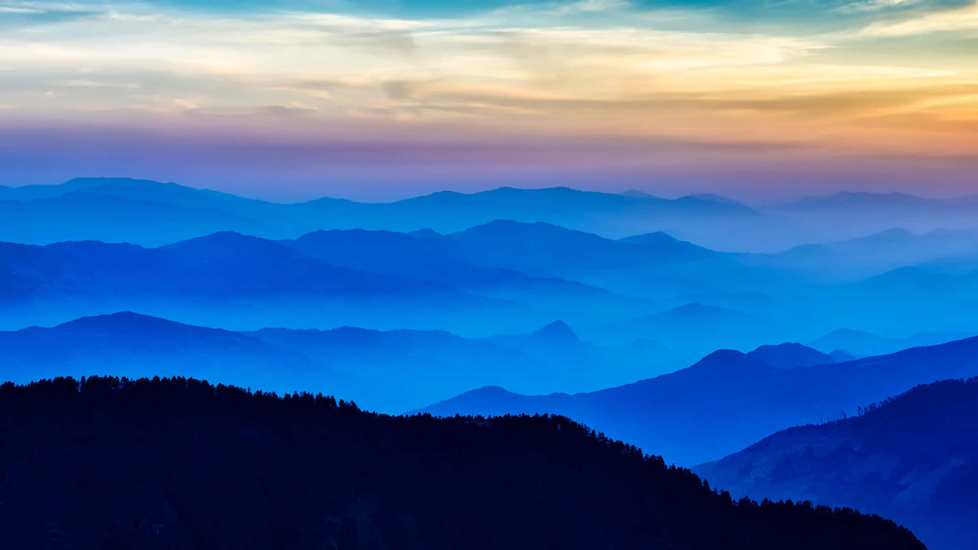 Blue Mountain Silhouettesat Sunset Wallpaper