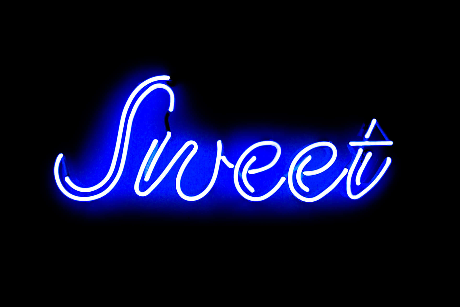 A Neon Sign With The Word Sweet On It Wallpaper