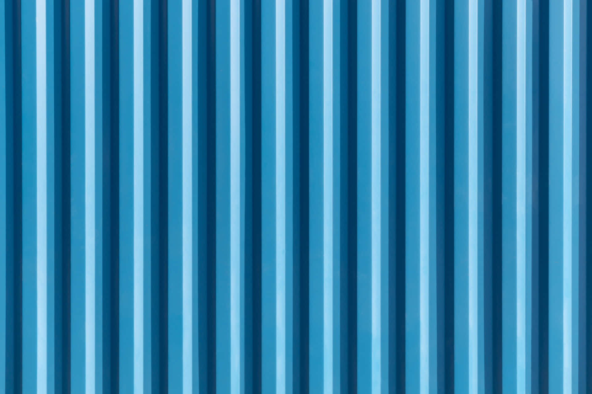 A Blue Corrugated Metal Wall With Vertical Lines